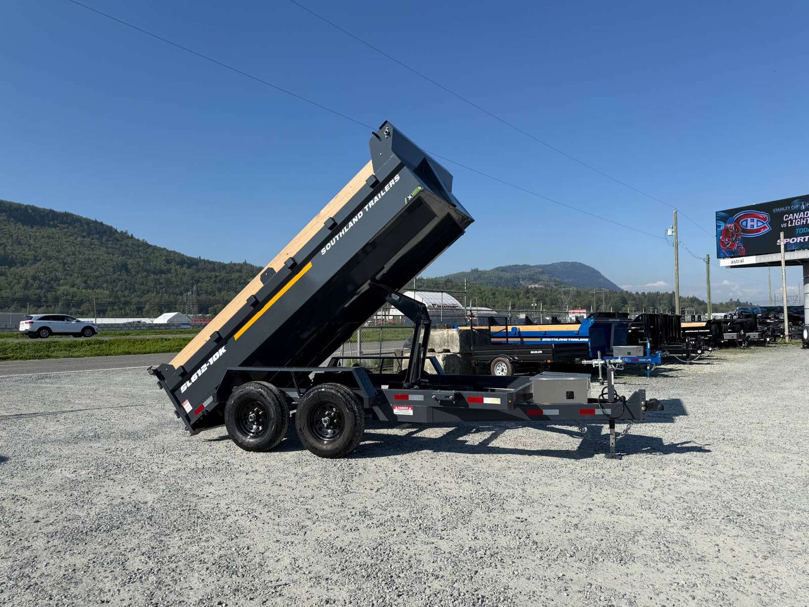 Photo of 2026 Southland 6X12 Dump Trailer 11,400LB GVW with Tarp and Ramps Charcoal Grey
