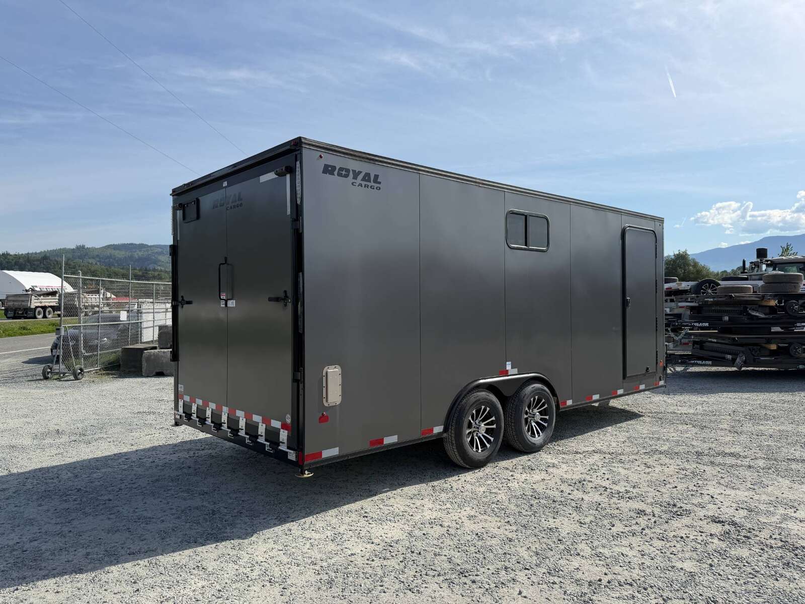 Photo of 2026 Royal 8.5x20 V Nose Cargo Enclosed Trailer Camping Package Charcoal Grey w/ Blackout Pkg, Insulated, Ramp Door, White Walls, 2x Windows & More!
