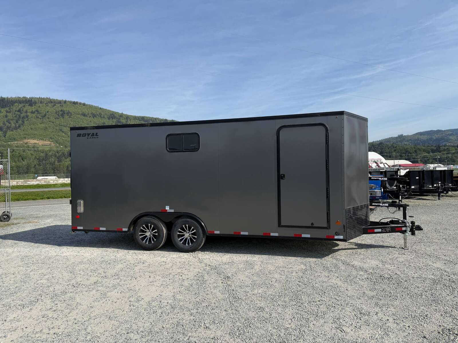 Photo of 2026 Royal 8.5x20 V Nose Cargo Enclosed Trailer Camping Package Charcoal Grey w/ Blackout Pkg, Insulated, Ramp Door, White Walls, 2x Windows & More!