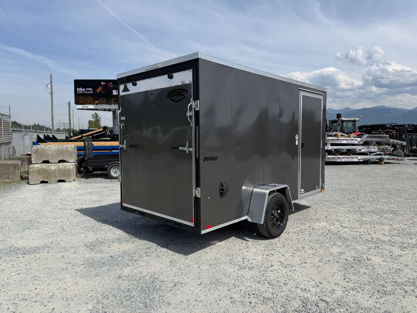Photo of 2026 Impact Quake 6x12 V Nose Cargo / Enclosed Trailer Charcoal Grey Ramp Door Extra Height 2990lb GVW