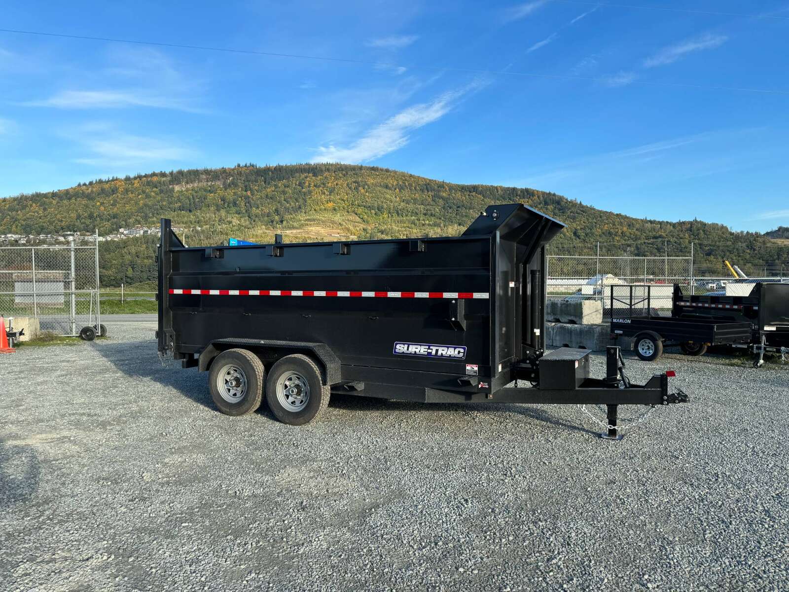 Photo of 2026 Suretrac 7x12 Telescopic High Side Dump Trailer 15,500lb GVW w/ Tarp and Ramps