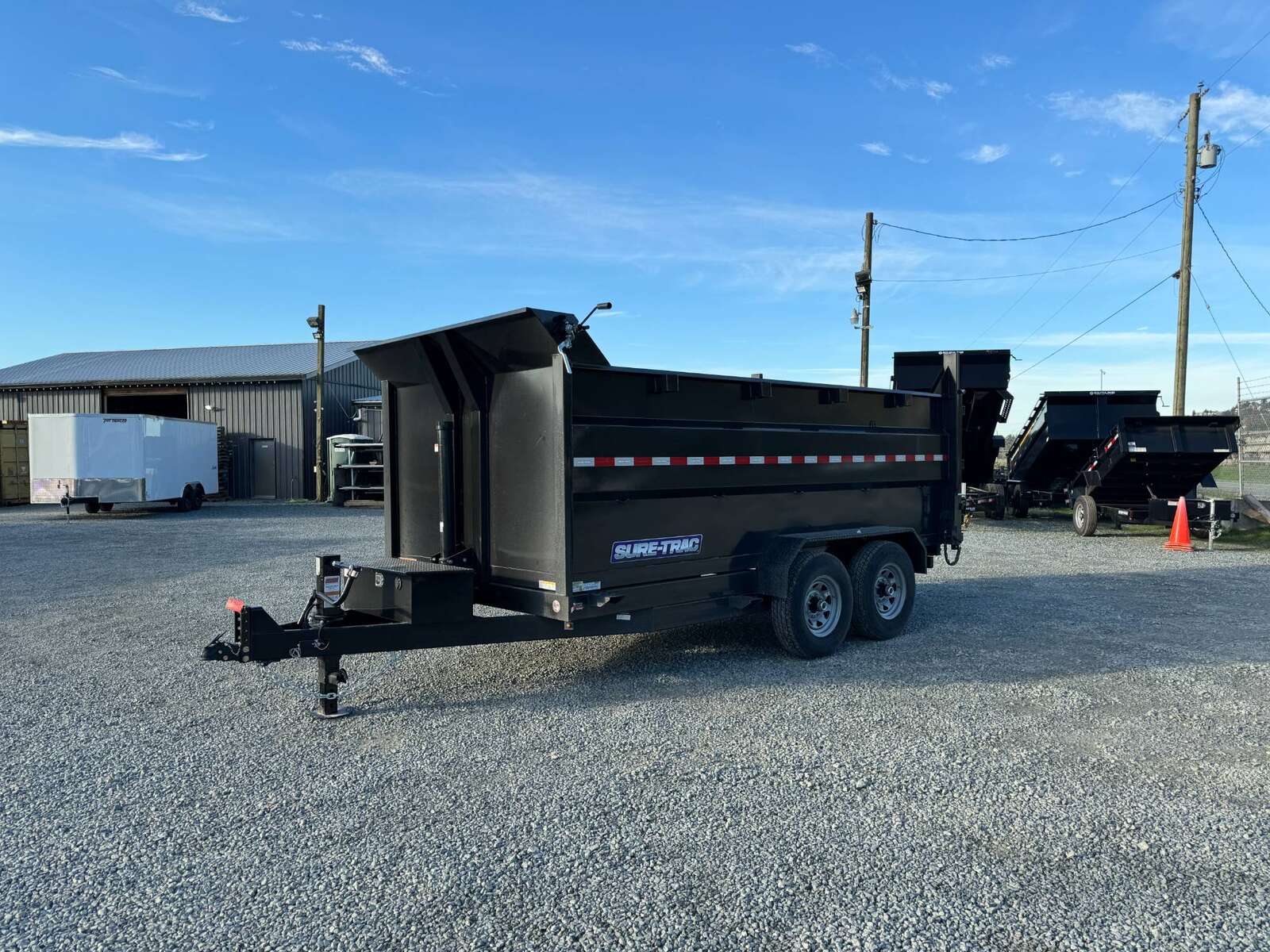 Photo of 2026 Suretrac 7x12 Telescopic High Side Dump Trailer 15,500lb GVW w/ Tarp and Ramps