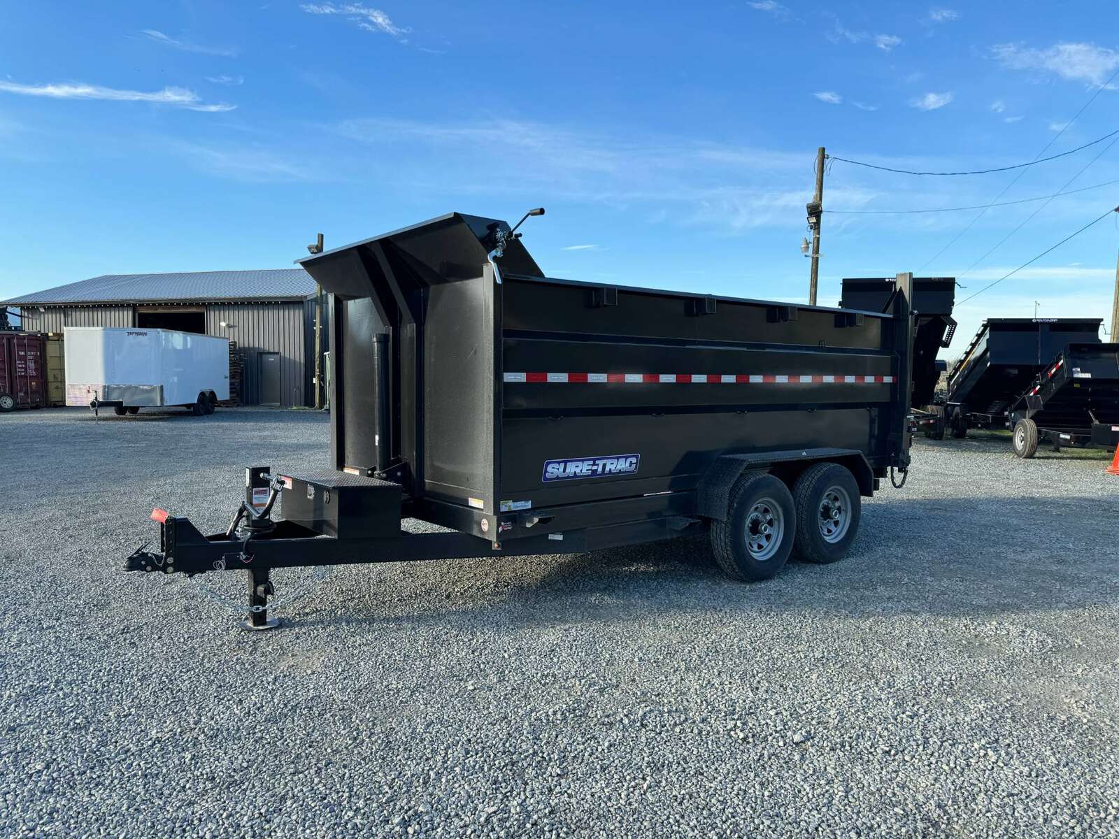 Photo of 2026 Suretrac 7x12 Telescopic High Side Dump Trailer 15,500lb GVW w/ Tarp and Ramps