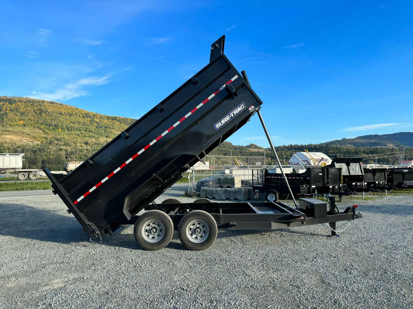 Photo of 2026 Suretrac 7x12 Telescopic High Side Dump Trailer 15,500lb GVW w/ Tarp and Ramps
