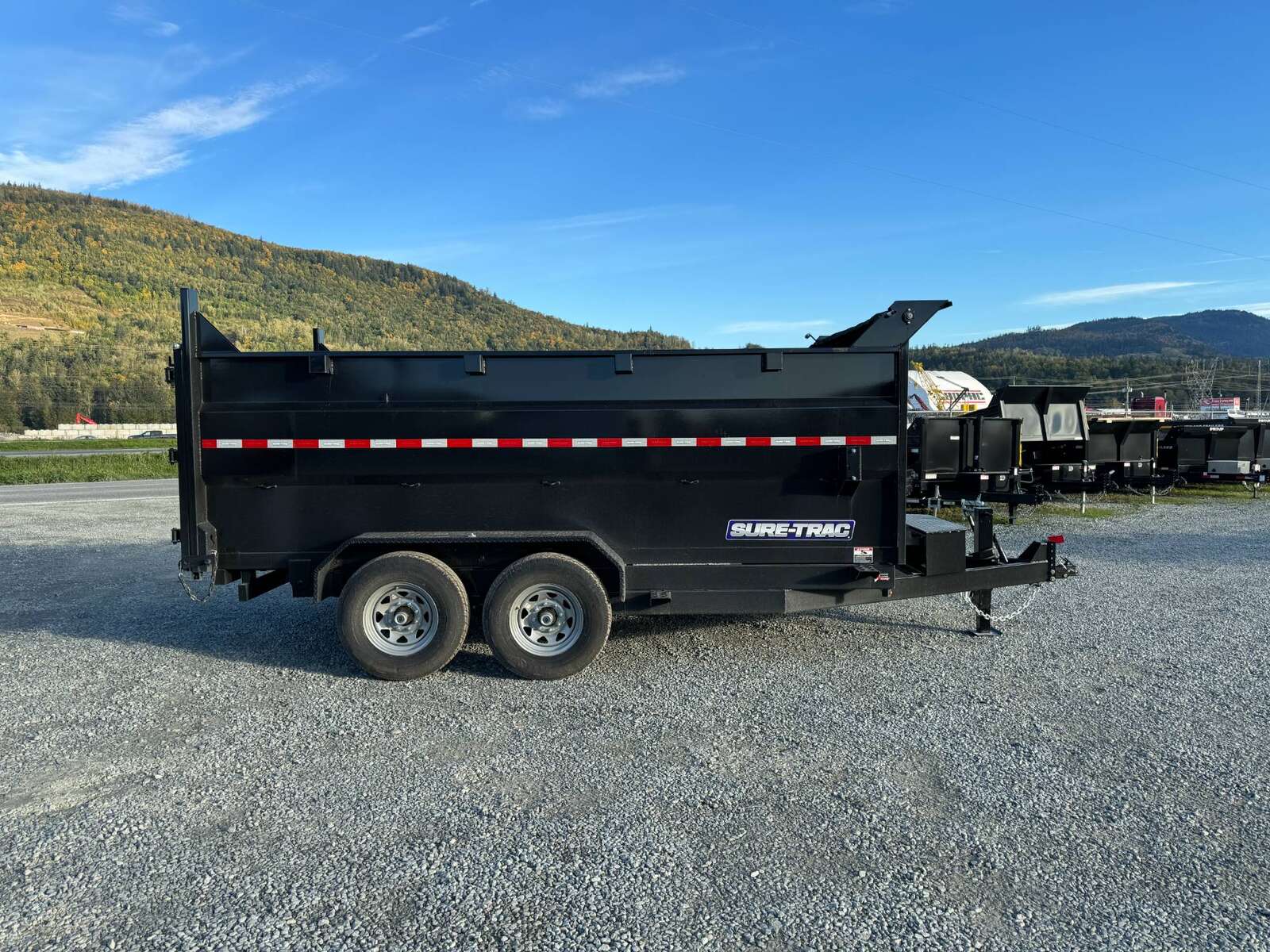 Photo of 2026 Suretrac 7x12 Telescopic High Side Dump Trailer 15,500lb GVW w/ Tarp and Ramps