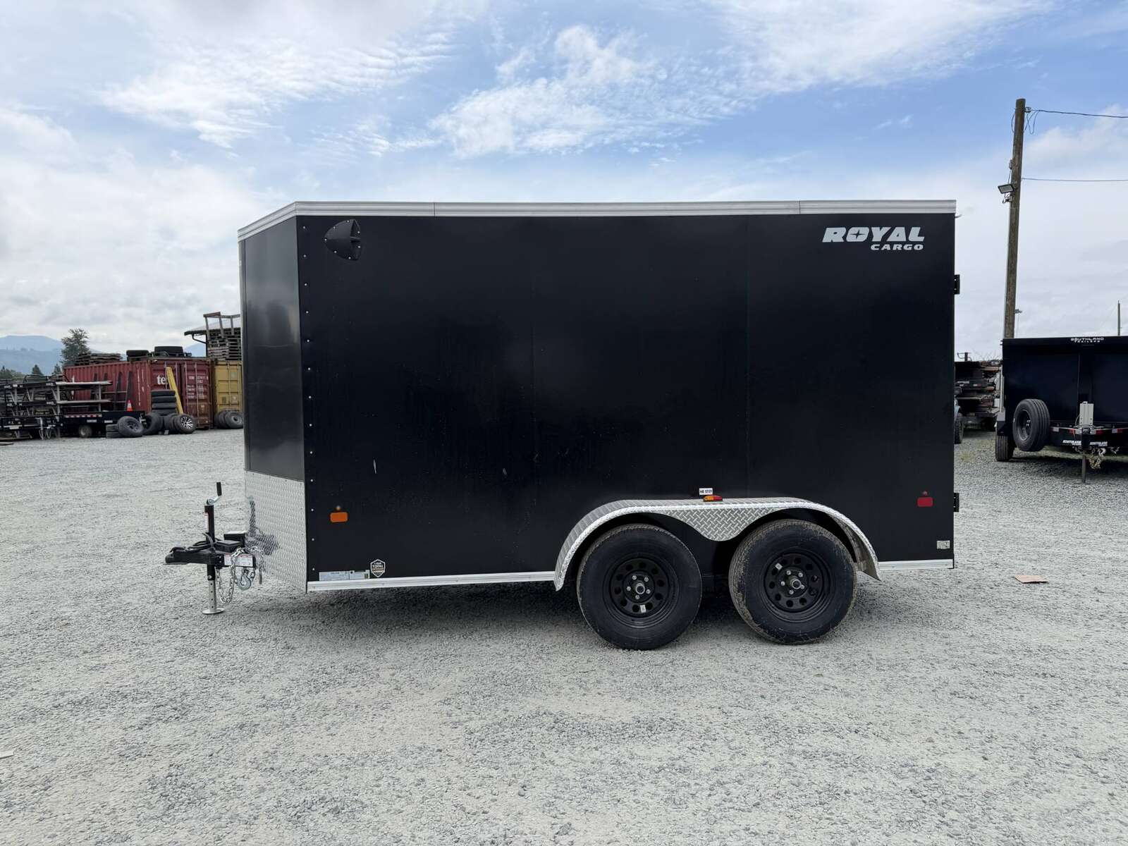 Photo of 2026 Royal Cargo 6x12 Enclosed Trailer Tandem Axle Rear Barn Doors Black 7700lbs GVW