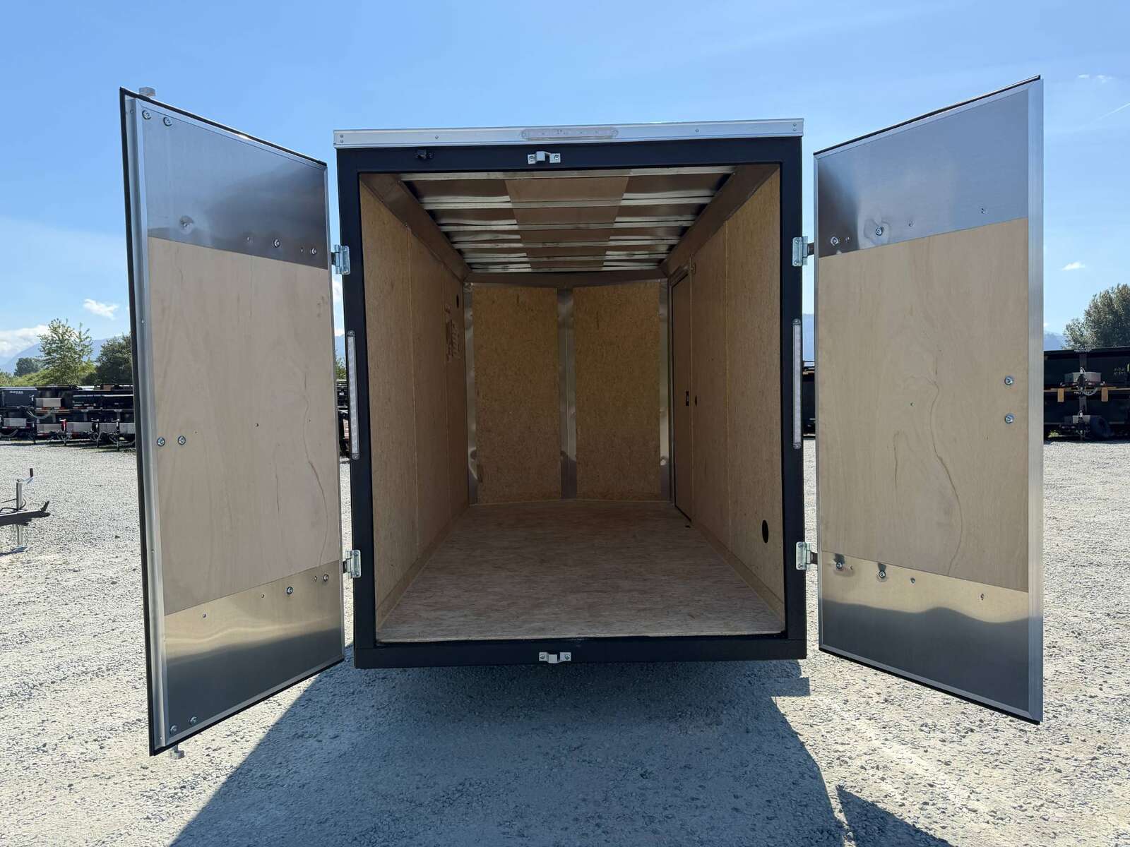 Photo of 2026 Impact Quake 6x12 V Nose Cargo / Enclosed Trailer Black Barn Doors Extra Height 2990lb GVW