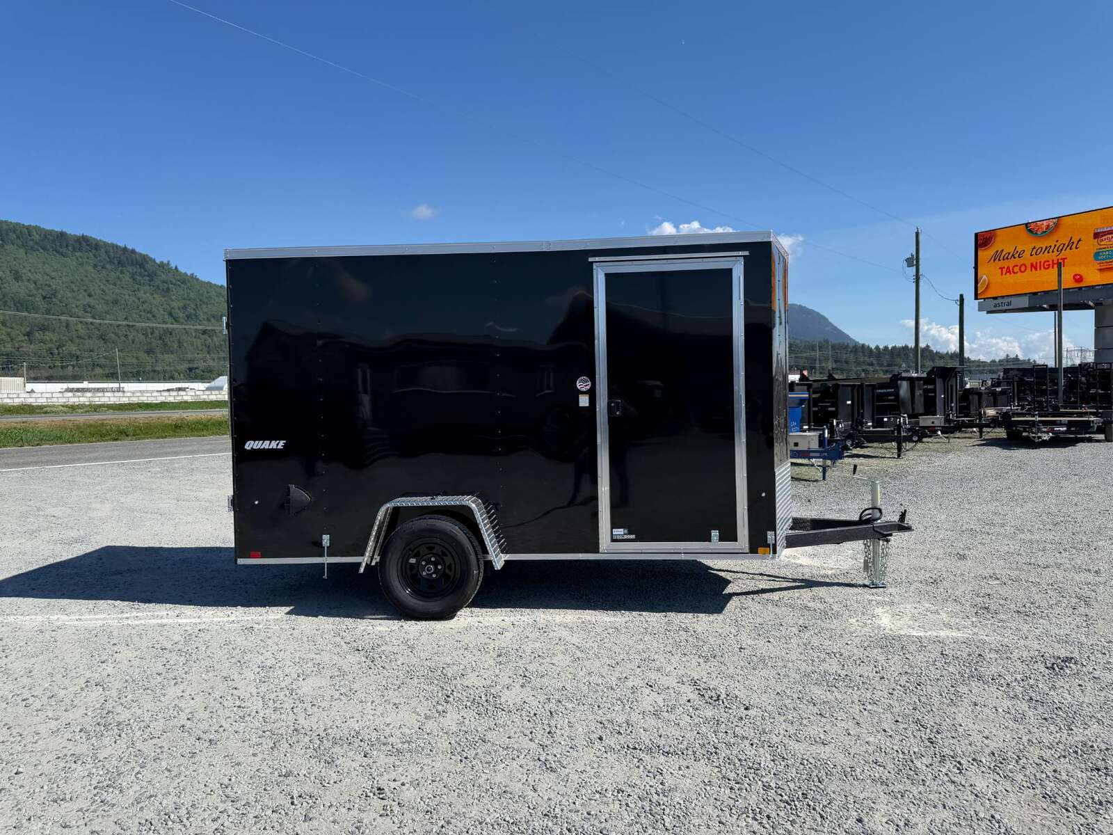 Photo of 2026 Impact Quake 6x12 V Nose Cargo / Enclosed Trailer Black Barn Doors Extra Height 2990lb GVW