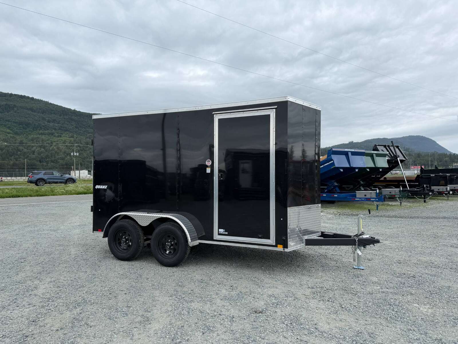 Photo of 2026 Impact Quake 6x12 V Nose Cargo / Enclosed Trailer Tandem Axle Black Barn Doors Extra Height 7000lb GVW
