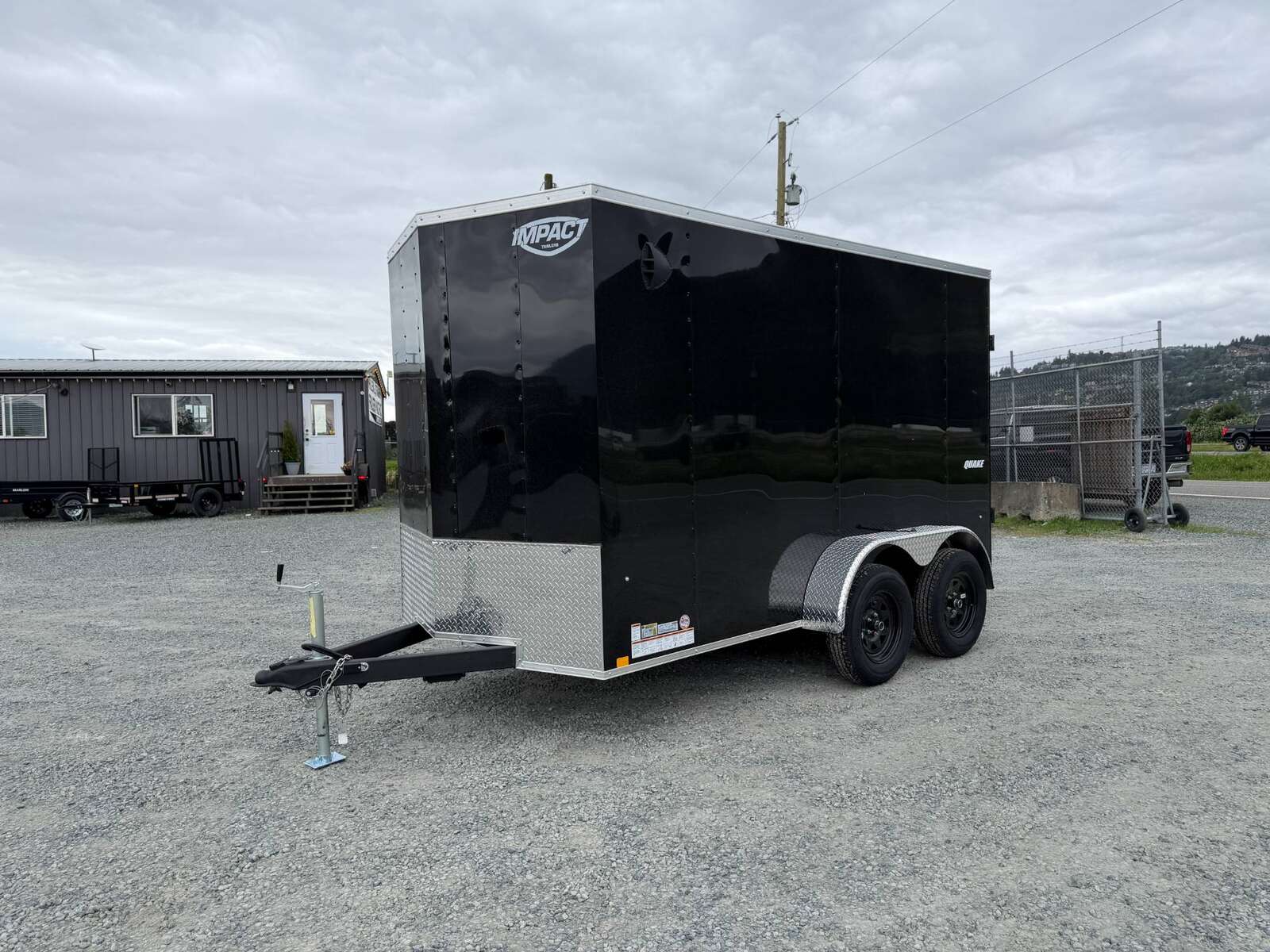 Photo of 2026 Impact Quake 6x12 V Nose Cargo / Enclosed Trailer Tandem Axle Black Barn Doors Extra Height 7000lb GVW