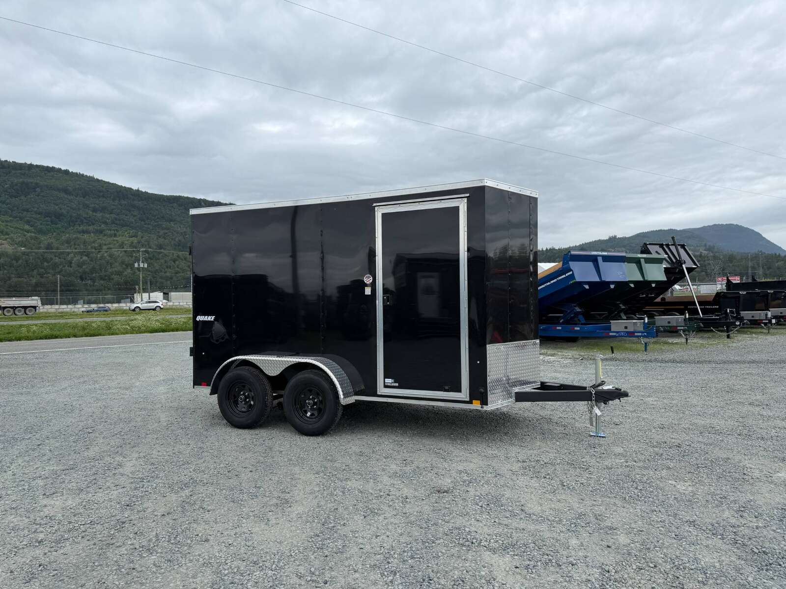 Photo of 2026 Impact Quake 6x12 V Nose Cargo / Enclosed Trailer Tandem Axle Black Barn Doors Extra Height 7000lb GVW