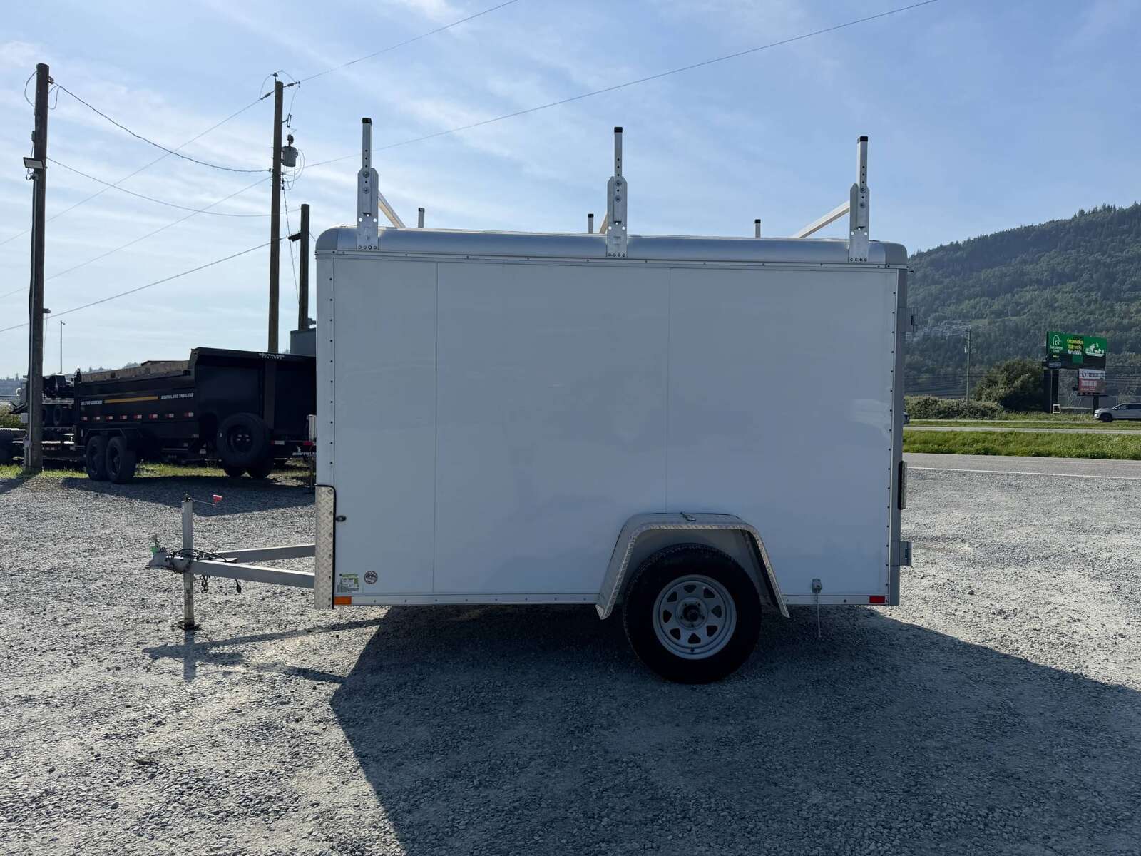 Photo of Used Pre Owned 2016 6x10 Wells Cargo Enclosed Trailer Barn Doors White 2990lb GVW