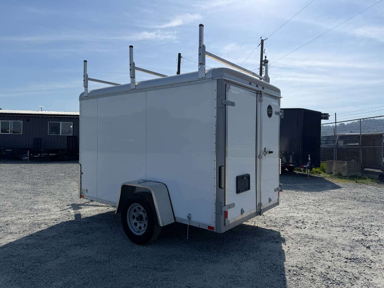 Photo of Used Pre Owned 2016 6x10 Wells Cargo Enclosed Trailer Barn Doors White 2990lb GVW