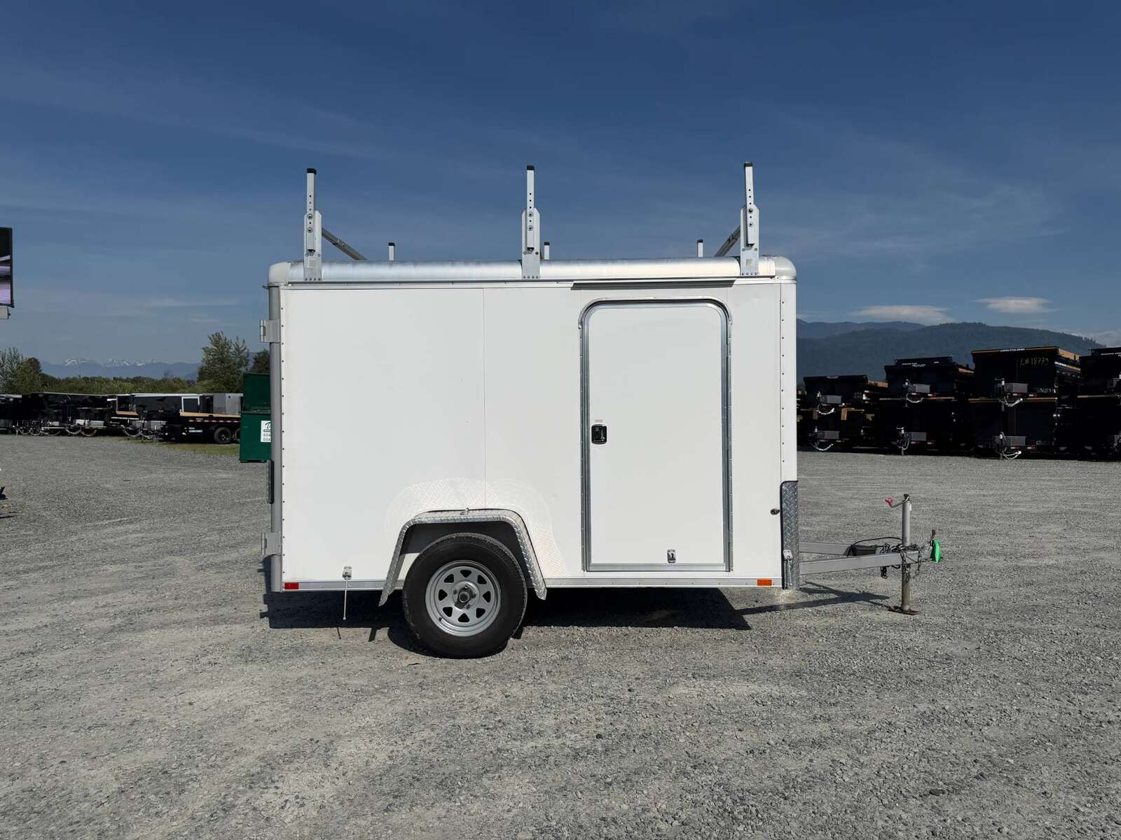 Photo of Used Pre Owned 2016 6x10 Wells Cargo Enclosed Trailer Barn Doors White 2990lb GVW