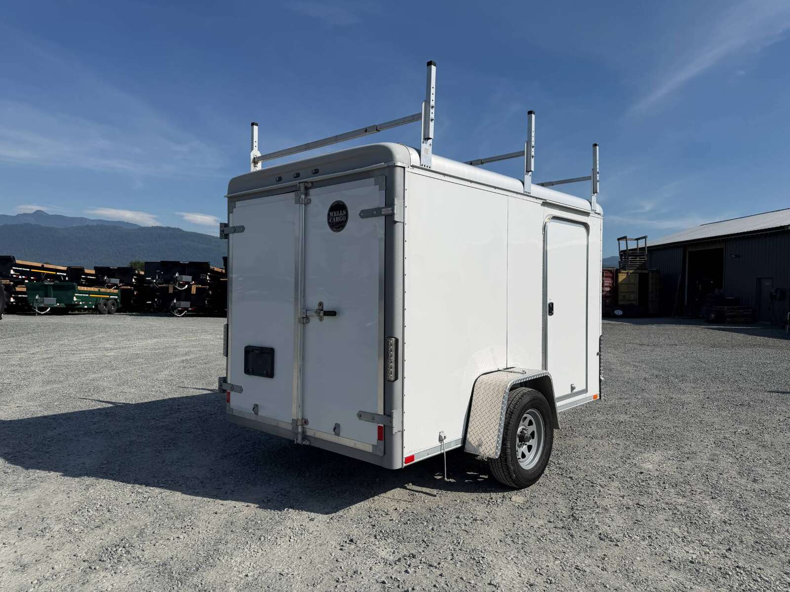 Photo of Used Pre Owned 2016 6x10 Wells Cargo Enclosed Trailer Barn Doors White 2990lb GVW