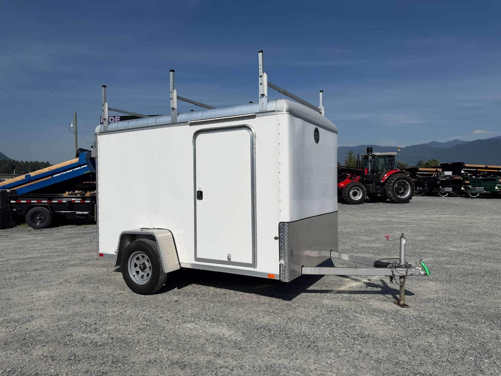 Photo of Used Pre Owned 2016 6x10 Wells Cargo Enclosed Trailer Barn Doors White 2990lb GVW