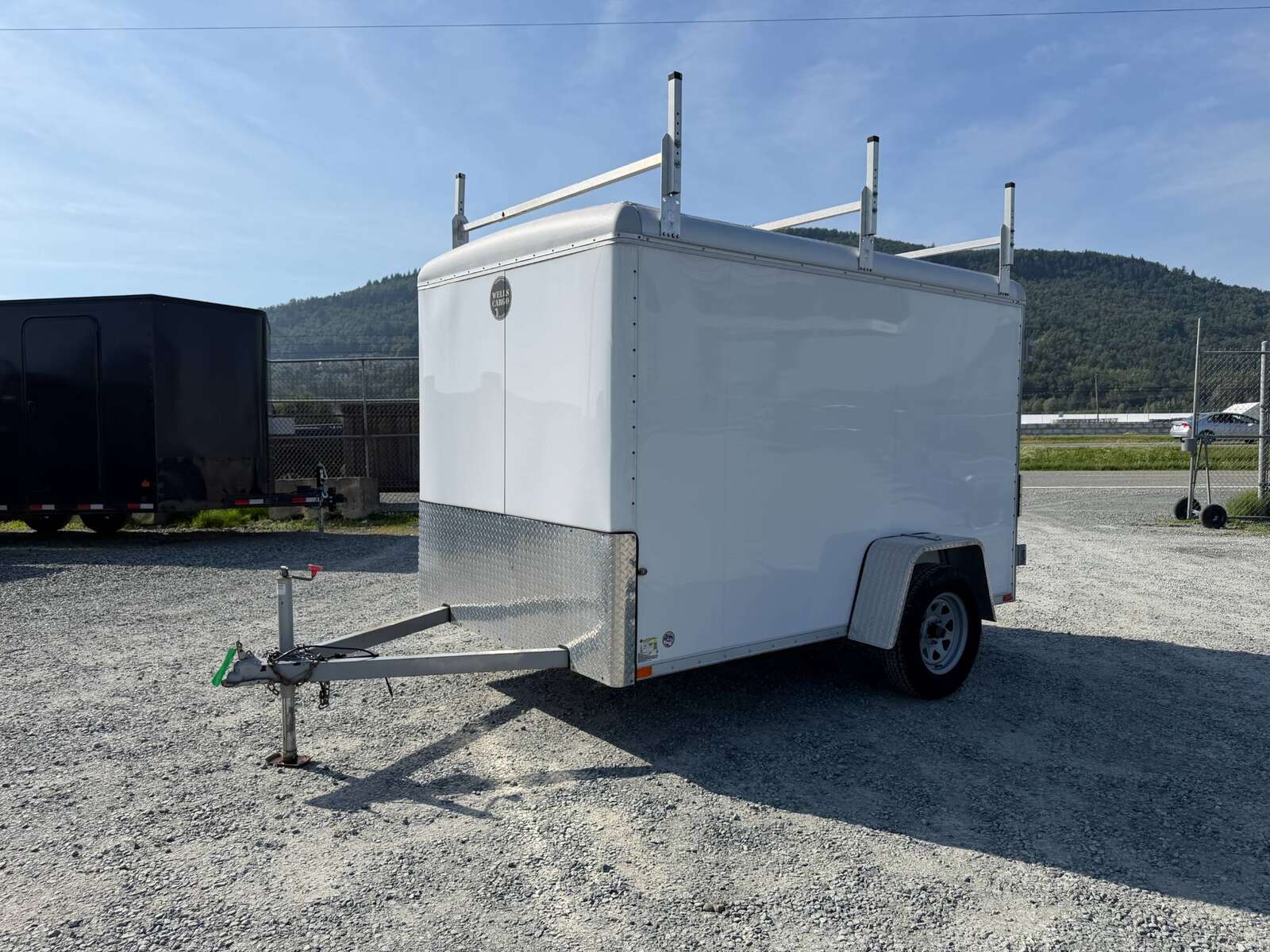 Photo of Used Pre Owned 2016 6x10 Wells Cargo Enclosed Trailer Barn Doors White 2990lb GVW