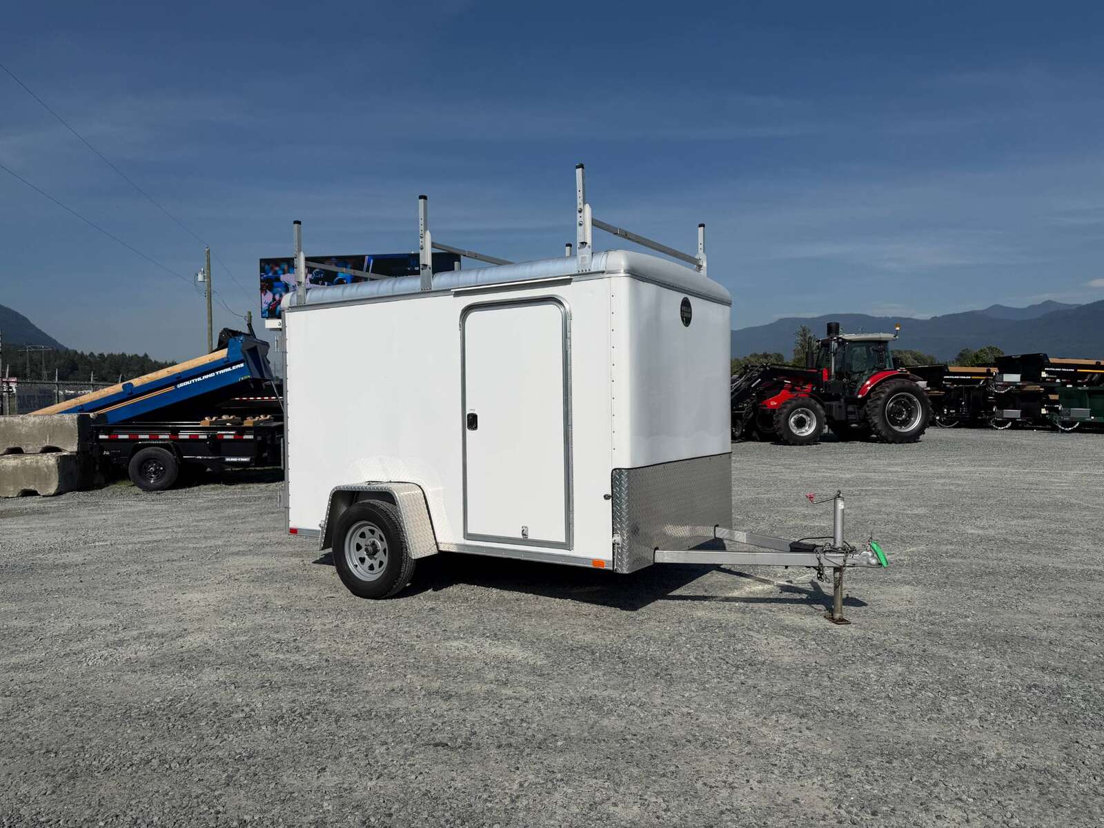 Photo of Used Pre Owned 2016 6x10 Wells Cargo Enclosed Trailer Barn Doors White 2990lb GVW