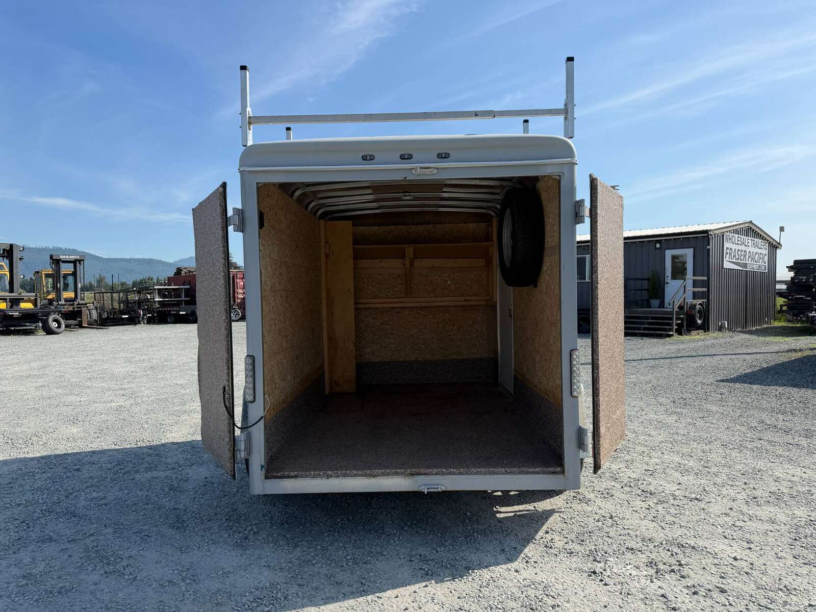 Photo of Used Pre Owned 2016 6x10 Wells Cargo Enclosed Trailer Barn Doors White 2990lb GVW