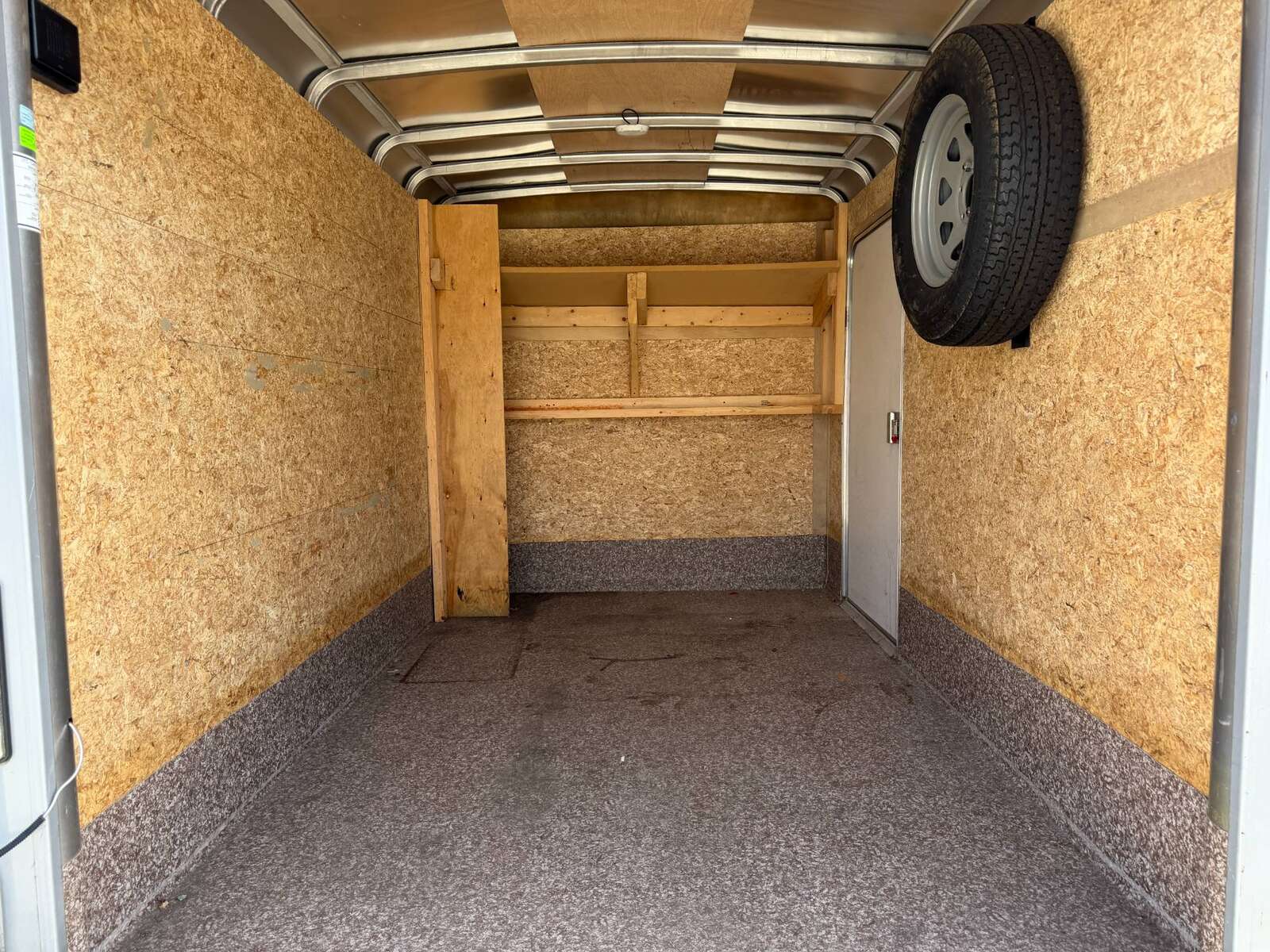 Photo of Used Pre Owned 2016 6x10 Wells Cargo Enclosed Trailer Barn Doors White 2990lb GVW