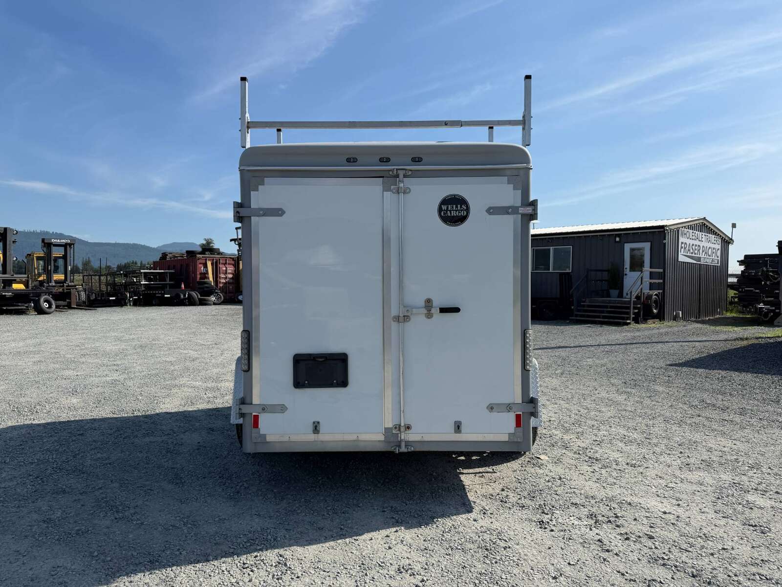Photo of Used Pre Owned 2016 6x10 Wells Cargo Enclosed Trailer Barn Doors White 2990lb GVW
