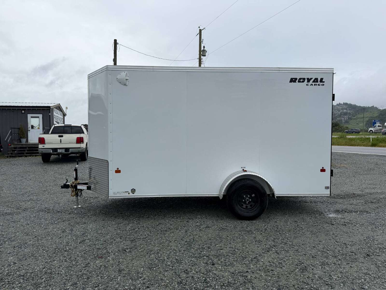 Photo of 2026 Royal Cargo 6x12 V Nose Cargo / Enclosed Trailer Barn Doors White Extra height 2900lb GVW