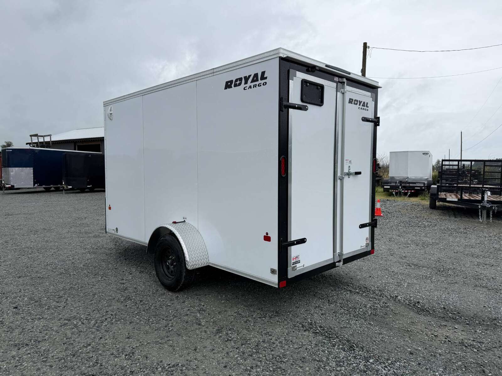 Photo of 2026 Royal Cargo 6x12 V Nose Cargo / Enclosed Trailer Barn Doors White Extra height 2900lb GVW