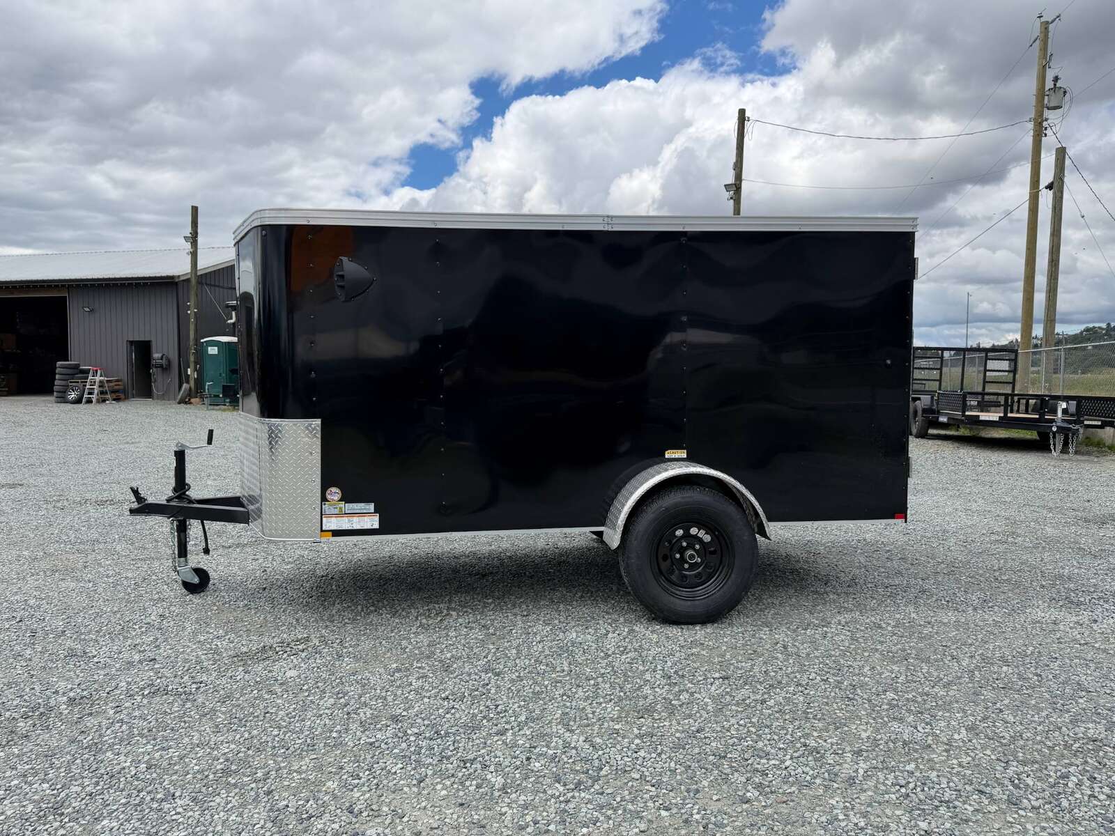 Photo of Pre Owned Used 2023 TNT 5x10 Enclosed Cargo Trailer 2990lb GVW Black V Nose w/ Ramp Door