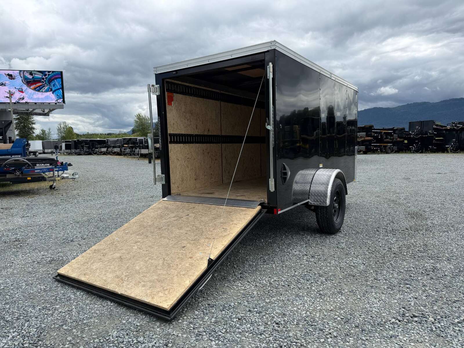 Photo of Pre Owned Used 2023 TNT 5x10 Enclosed Cargo Trailer 2990lb GVW Black V Nose w/ Ramp Door
