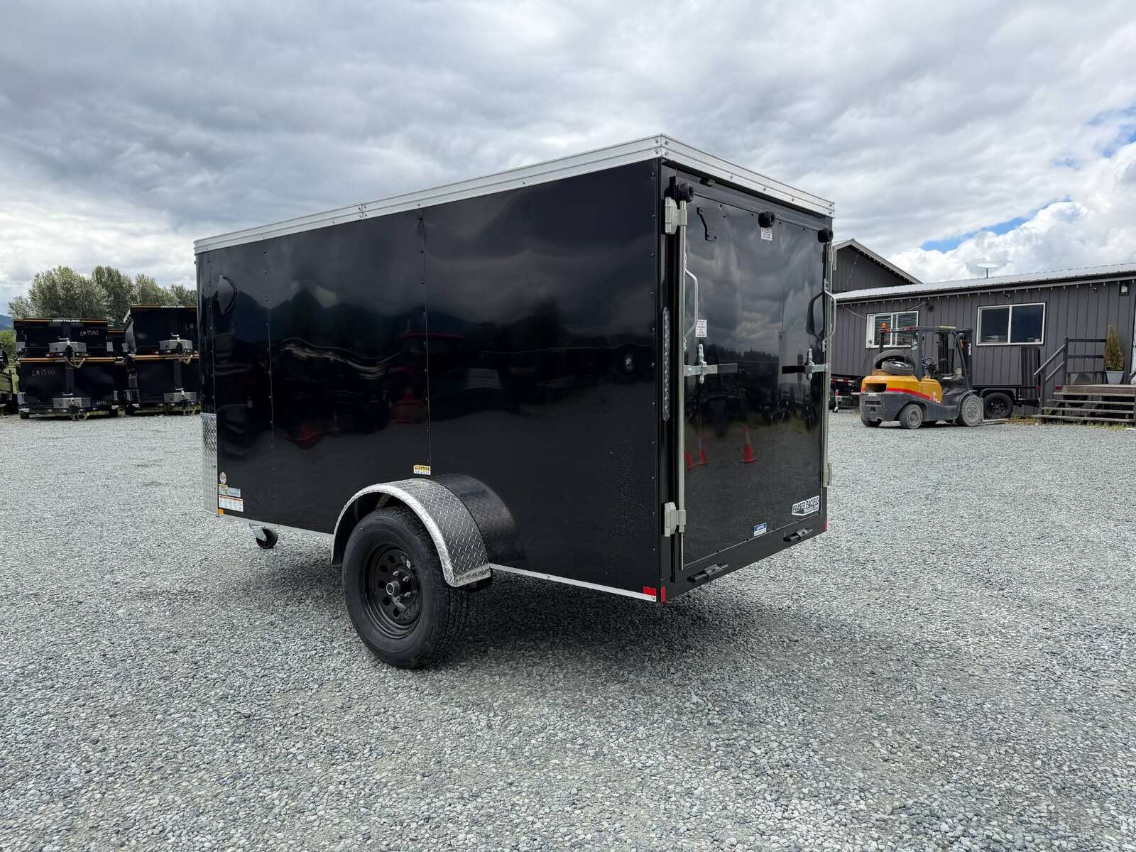 Photo of Pre Owned Used 2023 TNT 5x10 Enclosed Cargo Trailer 2990lb GVW Black V Nose w/ Ramp Door