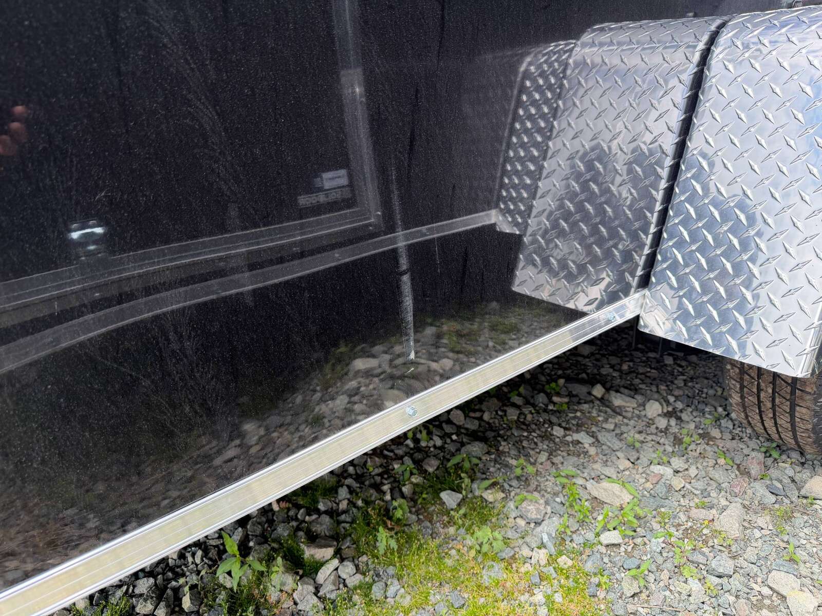 Photo of **Scratch Sale** 2026 Impact Quake 6x10 V Nose Cargo / Enclosed Trailer Black Barn Doors Extra Height 2990lb GVW