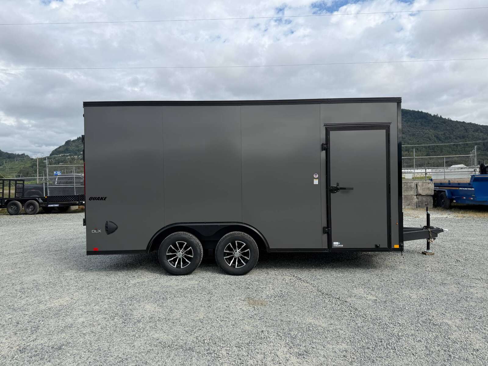 Photo of 2026 Impact 8.5x16 Quake V Nose Cargo / Enclosed Trailer Ramp Door Extra Height / Alu Wheels / Blackout Trim / Grey Polycor Exterior 7000lb GVW