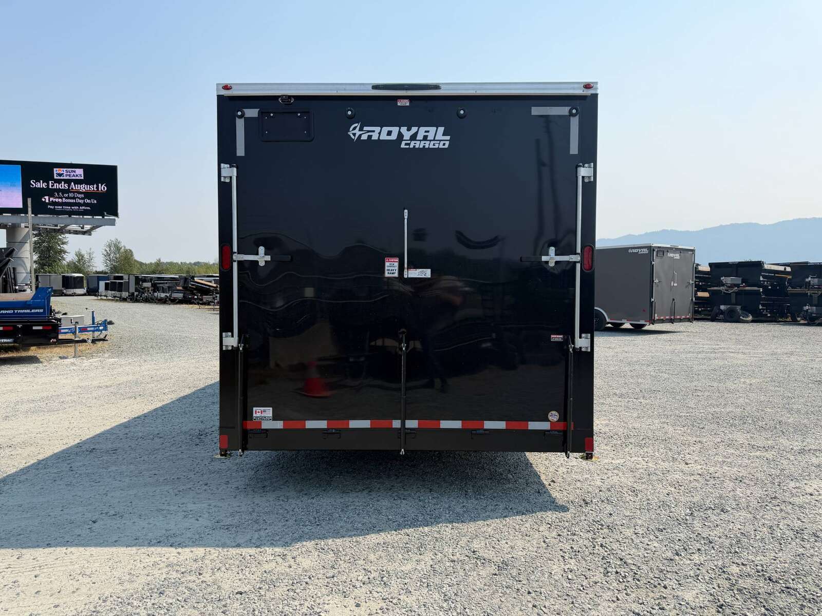 Photo of 2027 Royal Cargo 8.5x24 V Nose Car Hauler Cargo / Enclosed Trailer 11,400lb GVW GLOSS Black Ramp Door Extra Height (GSR)