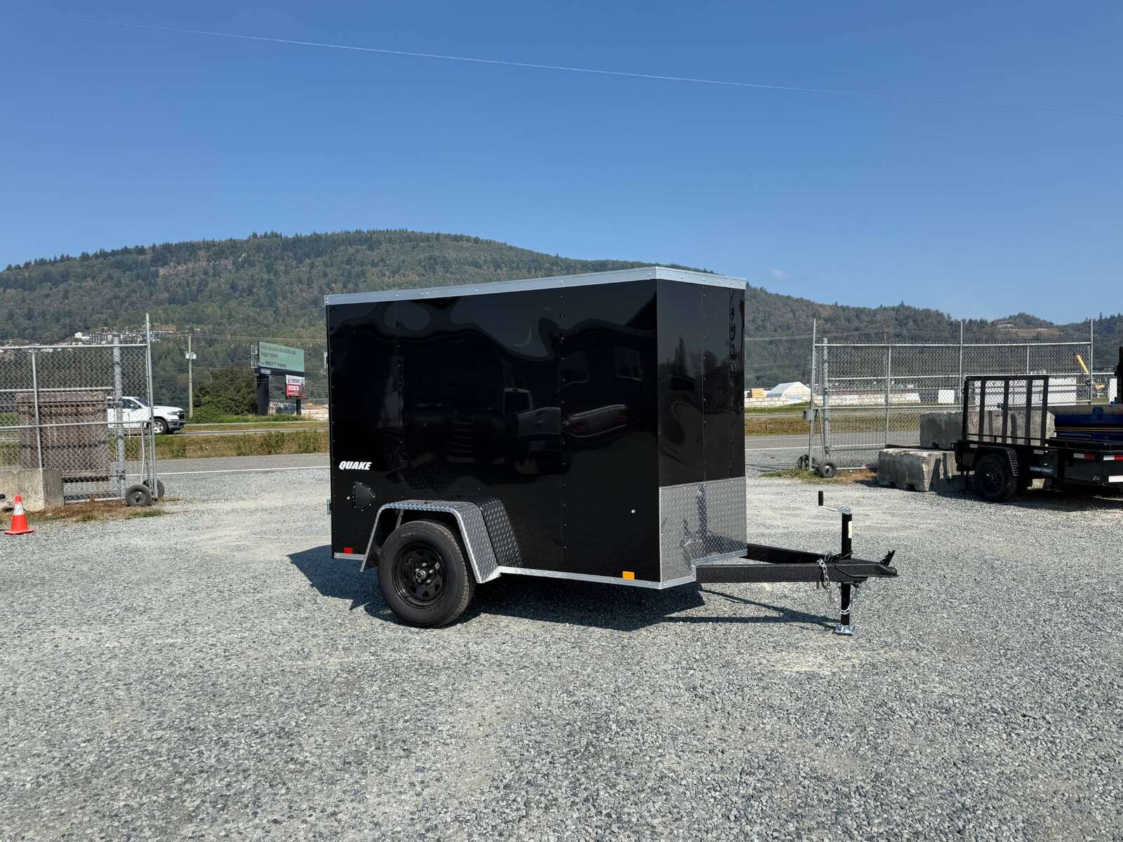 Photo of 2027 Impact 5x8 Quake V Nose Cargo Enclosed Trailer Ramp Door Black 2990lb GVW