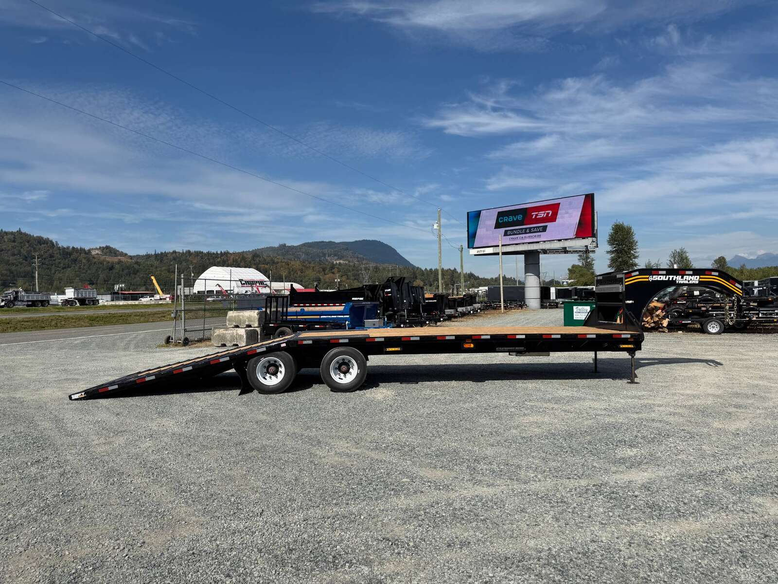 Photo of 2027 Southland 32' Gooseneck Equipment Flat Deck Trailer 38,000lbs w/ 12' Hydraulic Dovetail