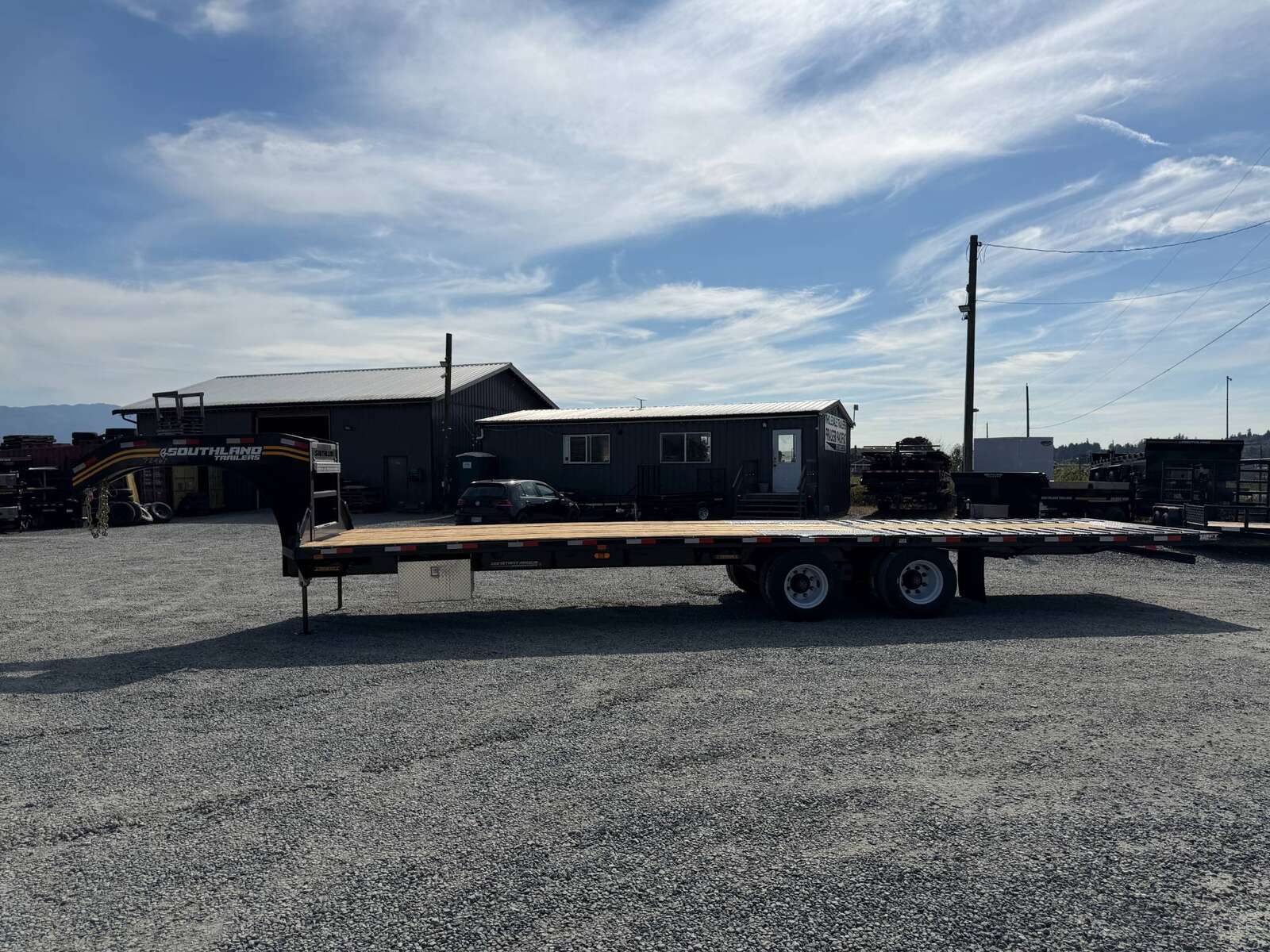 Photo of 2027 Southland 32' Gooseneck Equipment Flat Deck Trailer 38,000lbs w/ 12' Hydraulic Dovetail