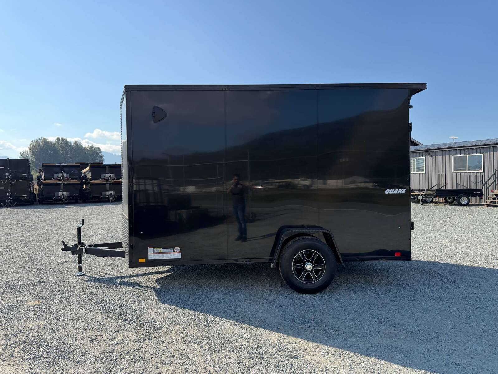 Photo of 2027 Impact Quake 7x12 V Nose Cargo / Enclosed Trailer / Black Polycor Exterior / 5000lb GVW Brake Axle w/ Ramp Door