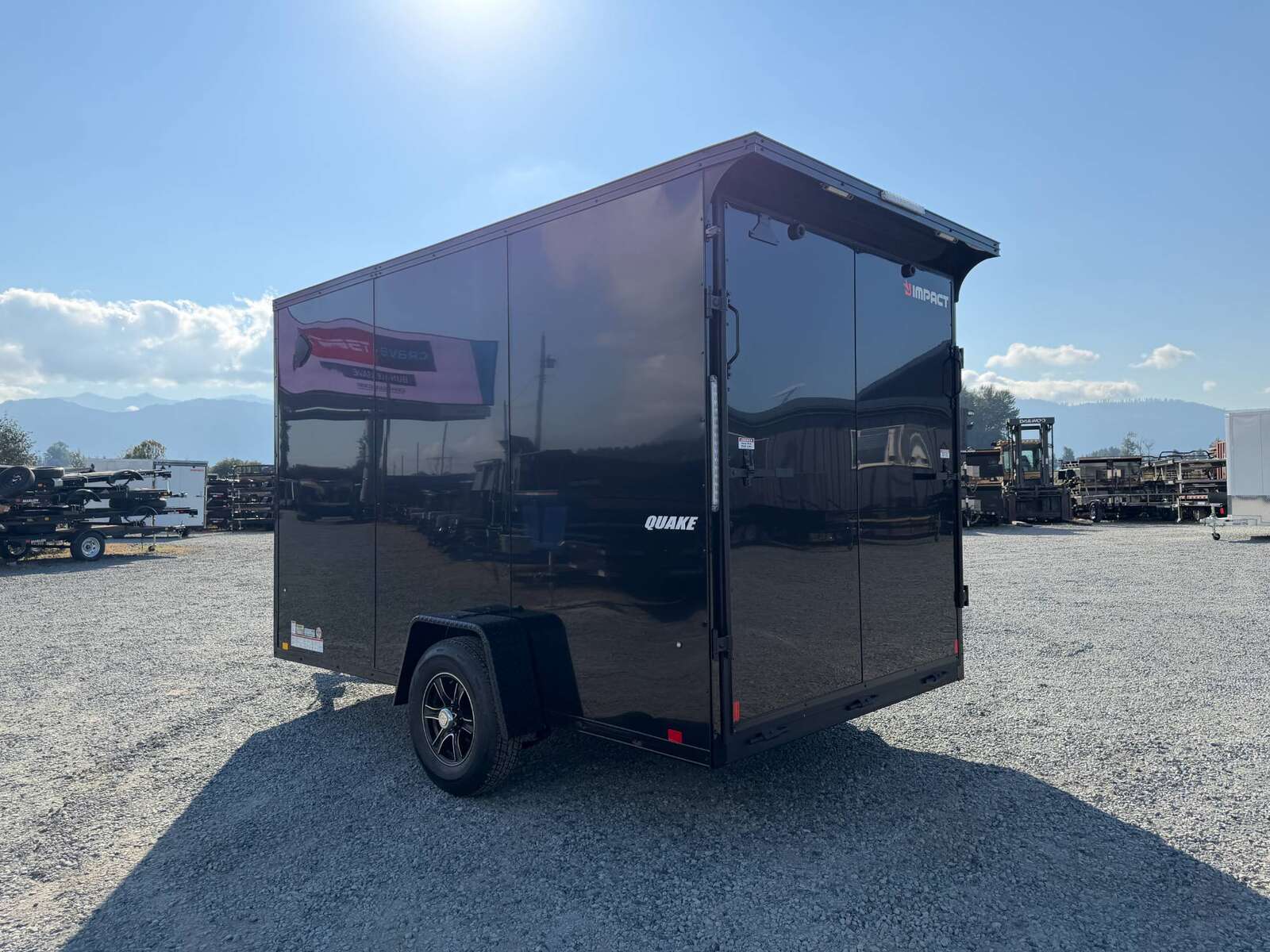 Photo of 2027 Impact Quake 7x12 V Nose Cargo / Enclosed Trailer / Black Polycor Exterior / 5000lb GVW Brake Axle w/ Ramp Door
