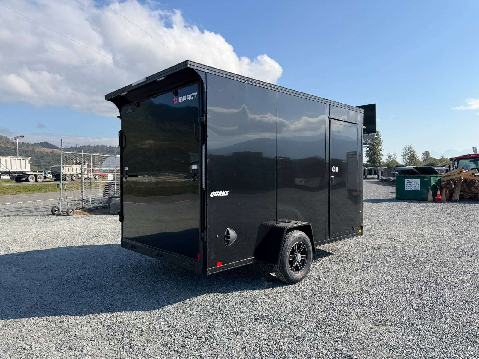 Photo of 2027 Impact Quake 7x12 V Nose Cargo / Enclosed Trailer / Black Polycor Exterior / 5000lb GVW Brake Axle w/ Ramp Door