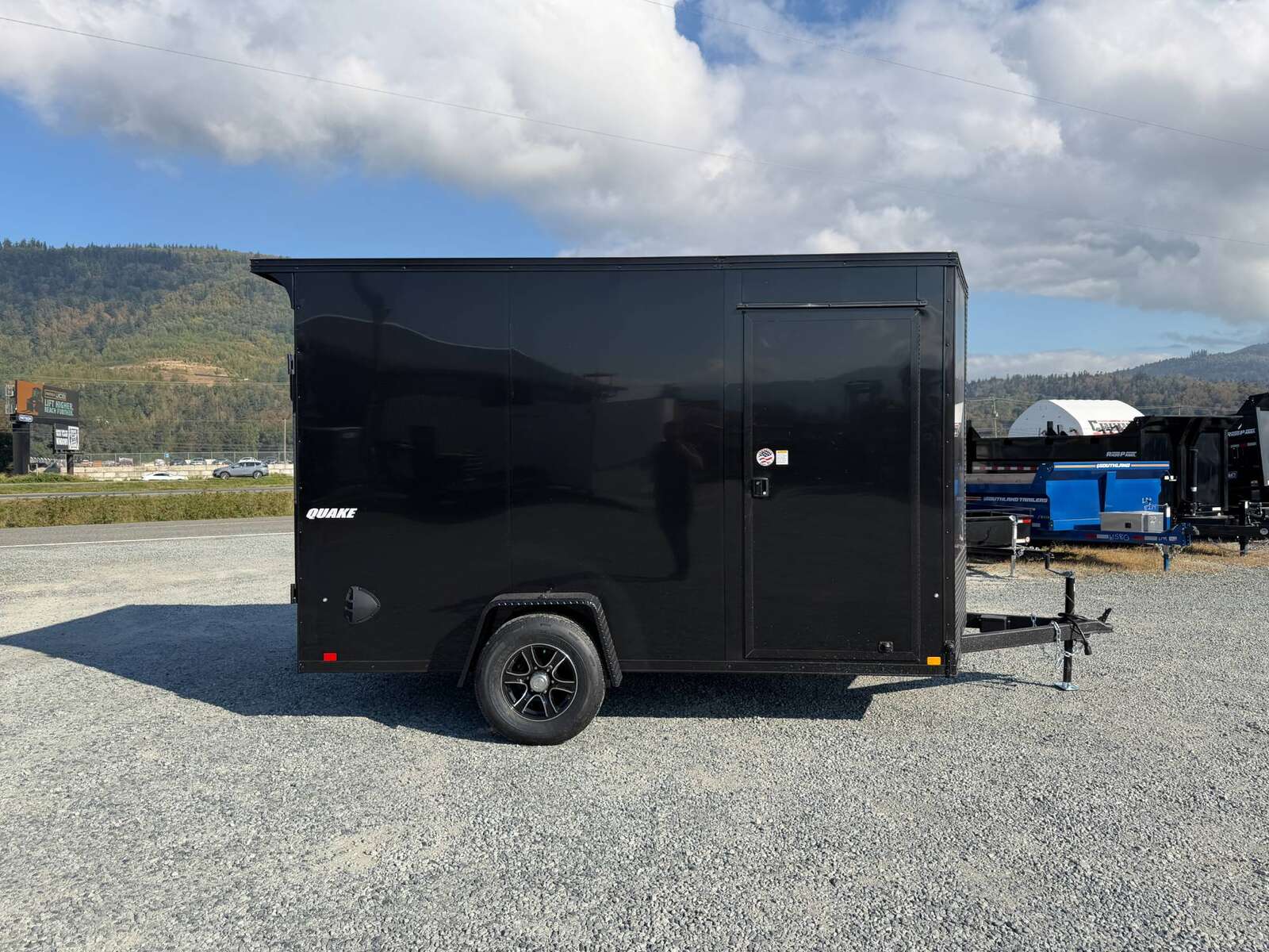 Photo of 2027 Impact Quake 7x12 V Nose Cargo / Enclosed Trailer / Black Polycor Exterior / 5000lb GVW Brake Axle w/ Ramp Door