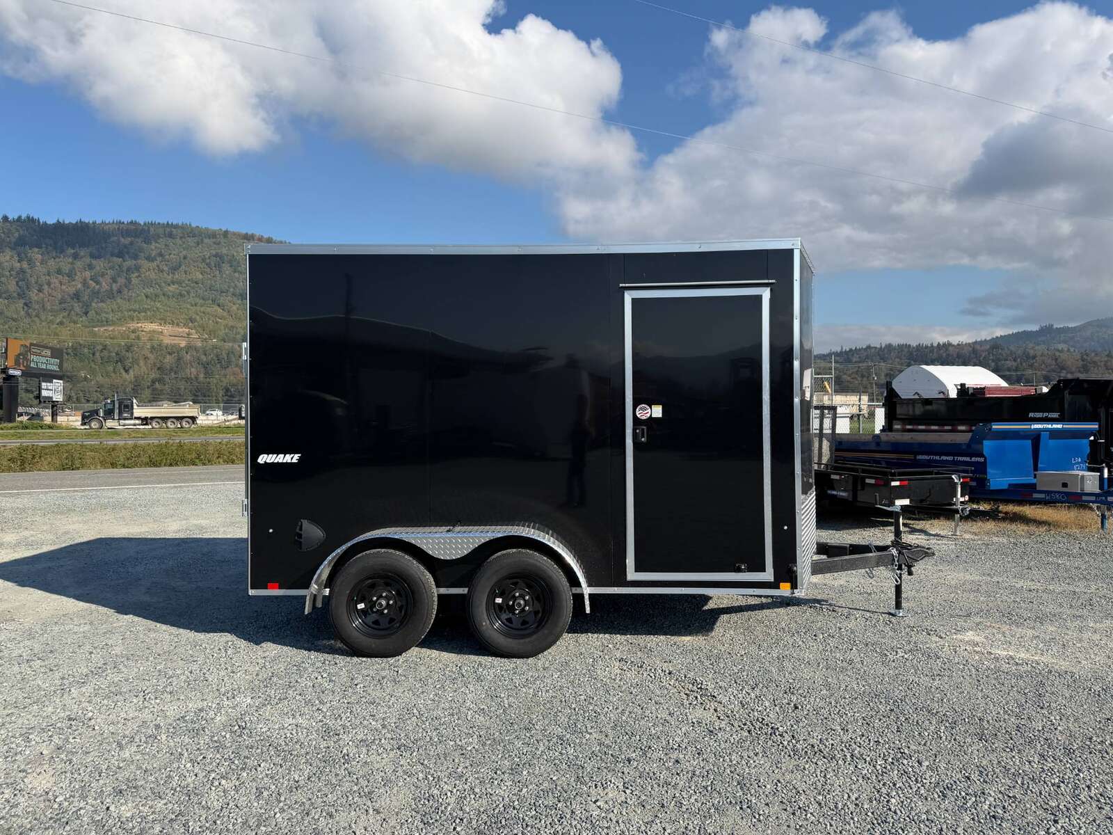 Photo of 2027 Impact Quake 7x12 Cargo Enclosed Trailer Tandem Axle 7000lb GVW / POLYCOR Black Exterior / Extra Height w/ Ramp Door