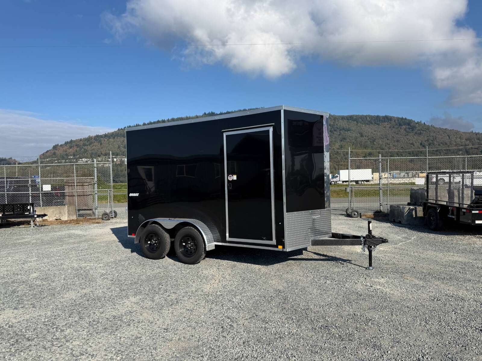 Photo of 2027 Impact Quake 7x12 Cargo Enclosed Trailer Tandem Axle 7000lb GVW / POLYCOR Black Exterior / Extra Height w/ Ramp Door