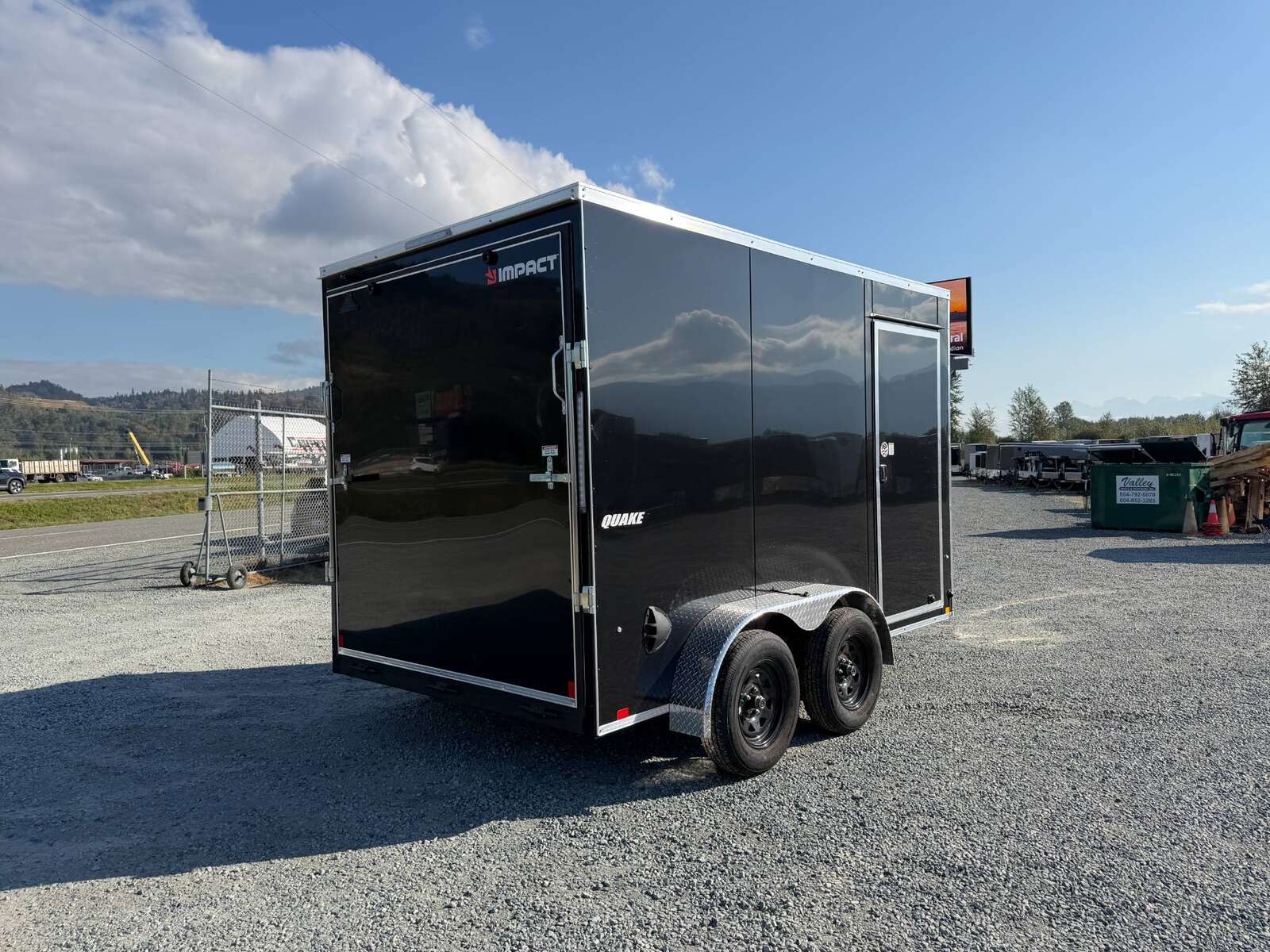 Photo of 2027 Impact Quake 7x12 Cargo Enclosed Trailer Tandem Axle 7000lb GVW / POLYCOR Black Exterior / Extra Height w/ Ramp Door