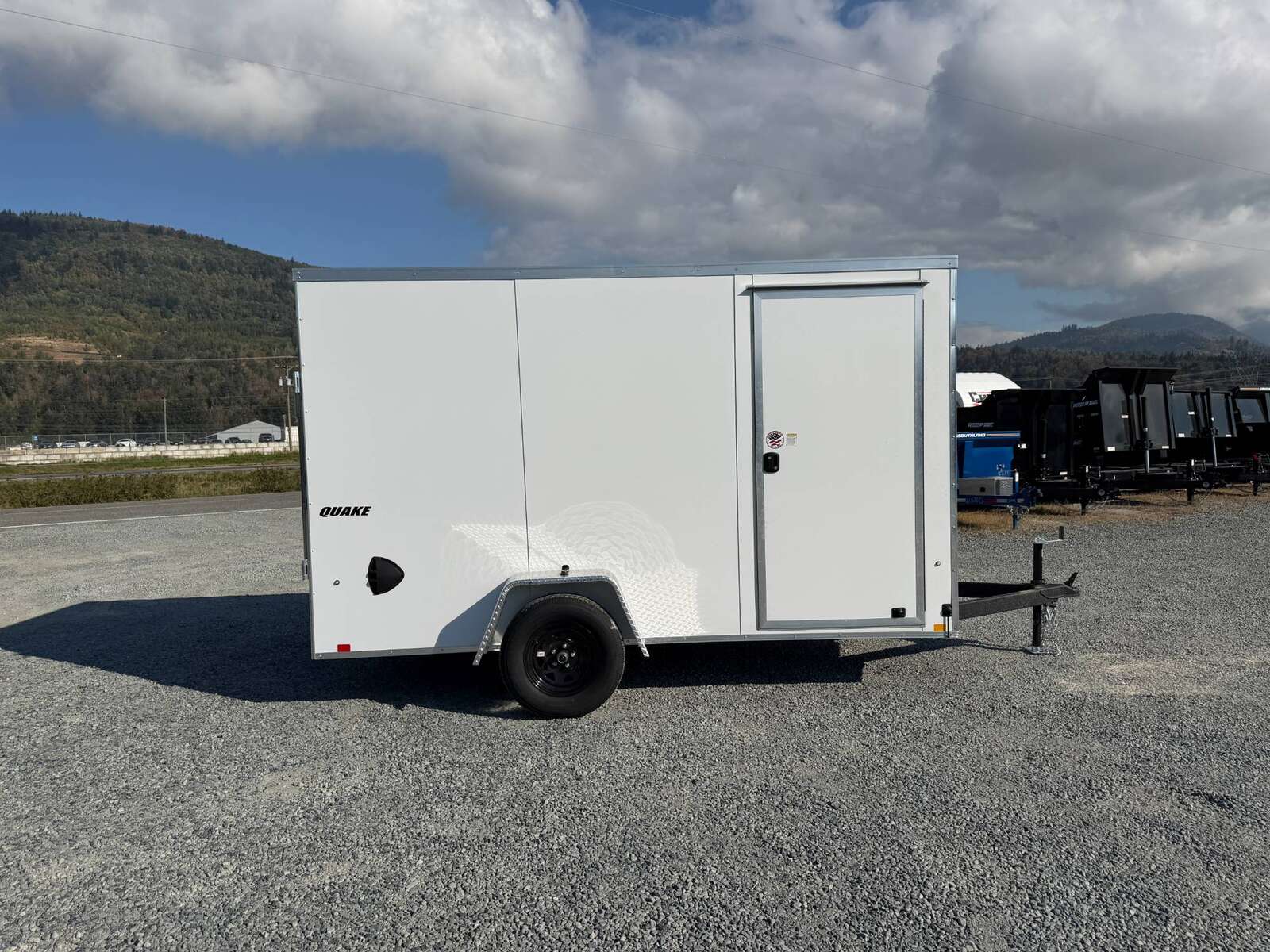 Photo of 2027 Impact Quake 6x12 V Nose Cargo / Enclosed Trailer / Polycor White Exterior / Ramp Door Extra Height 2990lb GVW