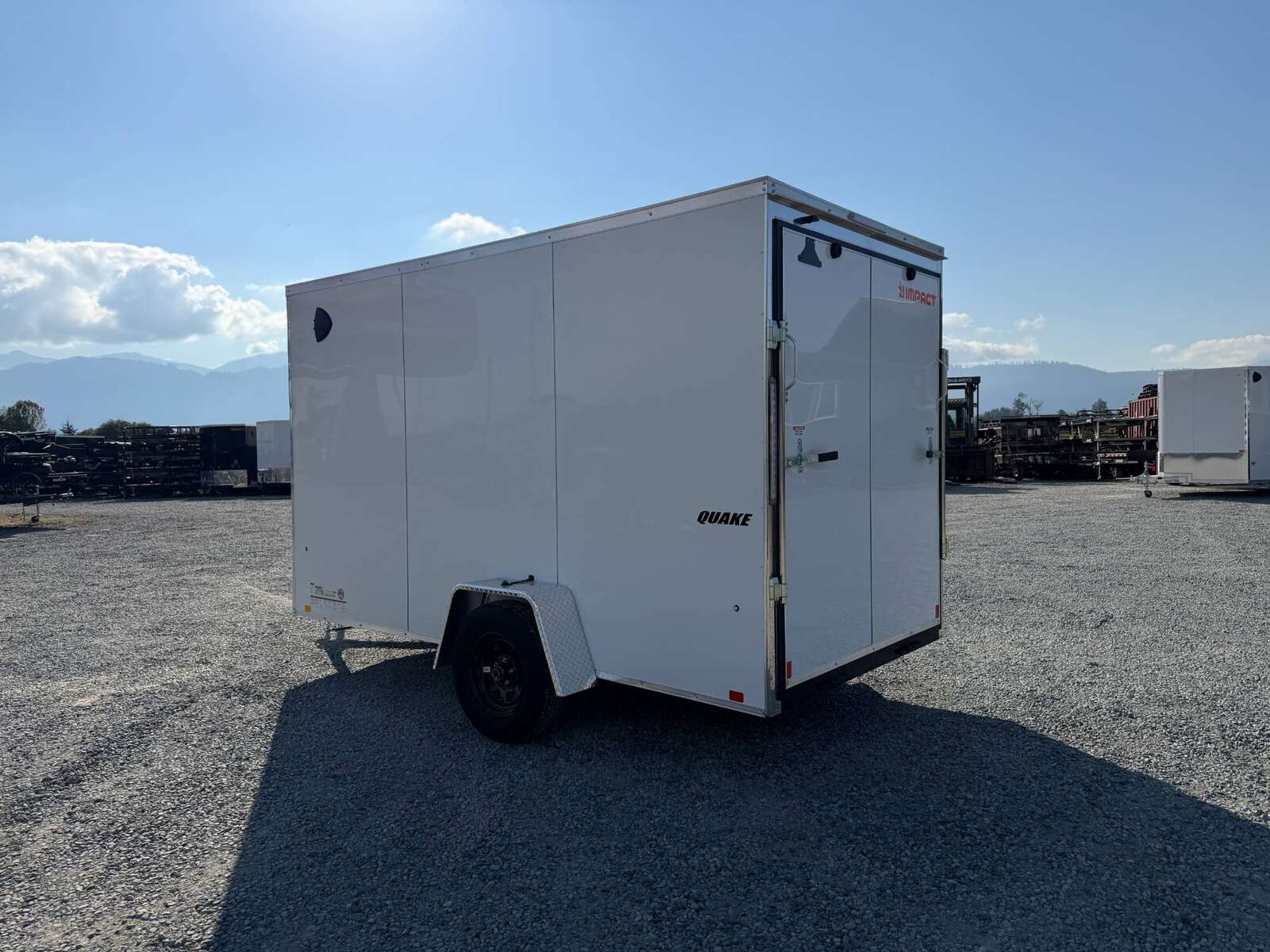 Photo of 2027 Impact Quake 6x12 V Nose Cargo / Enclosed Trailer / Polycor White Exterior / Ramp Door Extra Height 2990lb GVW