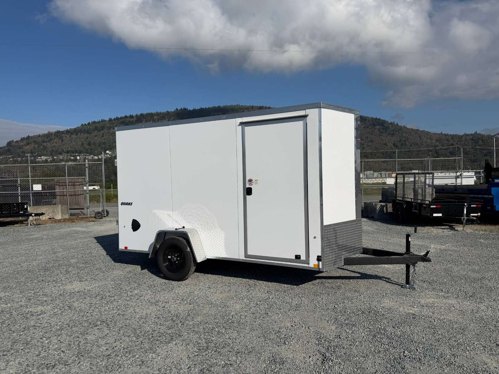 Photo of 2027 Impact Quake 6x12 V Nose Cargo / Enclosed Trailer / Polycor White Exterior / Ramp Door Extra Height 2990lb GVW