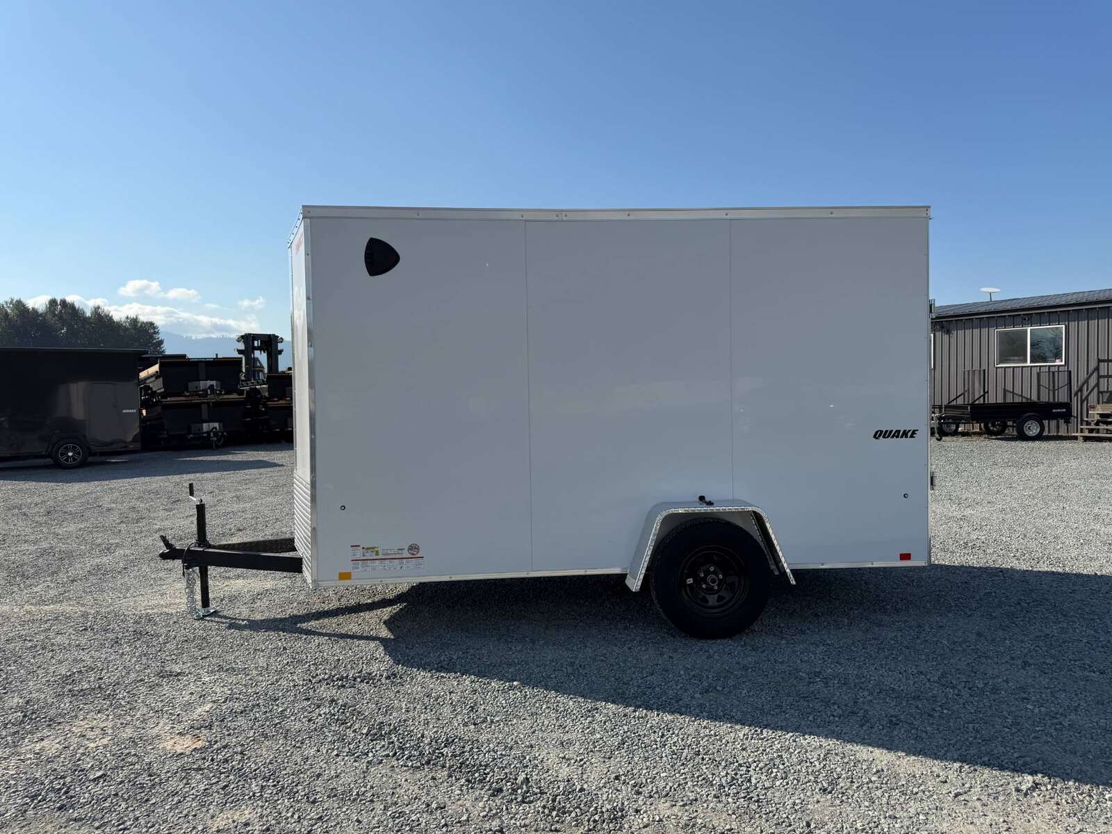 Photo of 2027 Impact Quake 6x12 V Nose Cargo / Enclosed Trailer / Polycor White Exterior / Ramp Door Extra Height 2990lb GVW