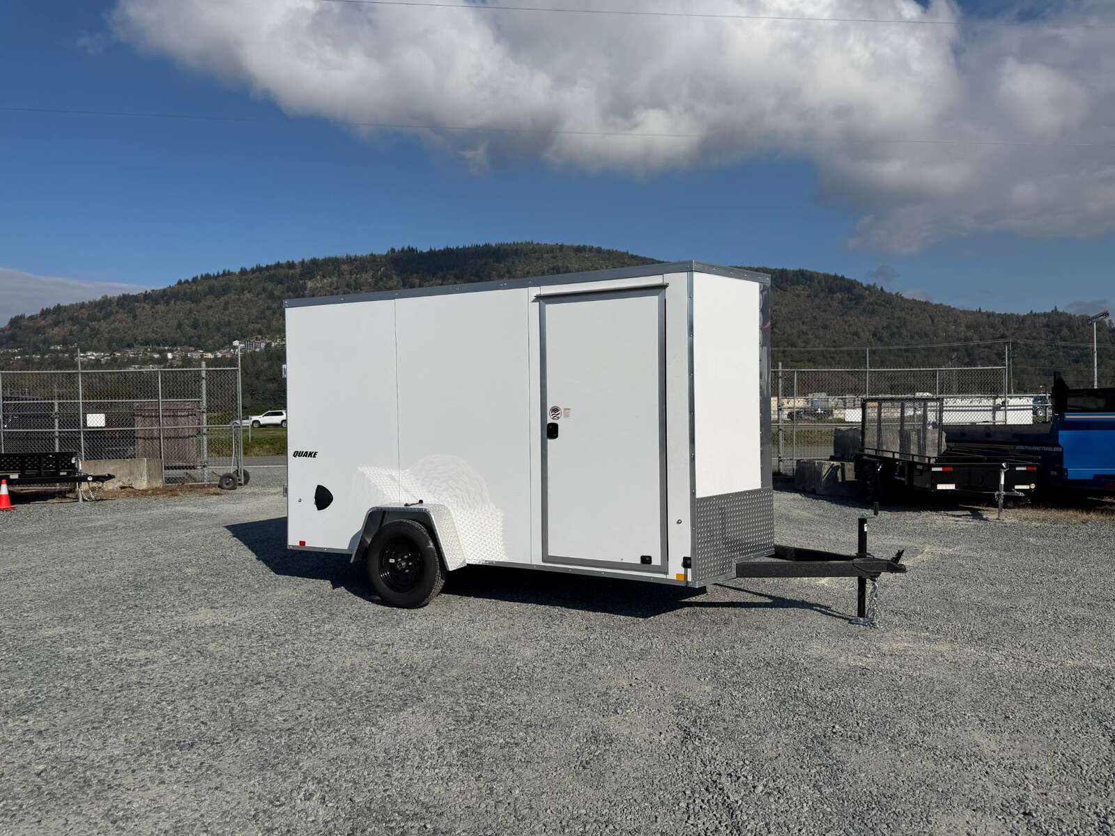 Photo of 2027 Impact Quake 6x12 V Nose Cargo / Enclosed Trailer / Polycor White Exterior / Ramp Door Extra Height 2990lb GVW