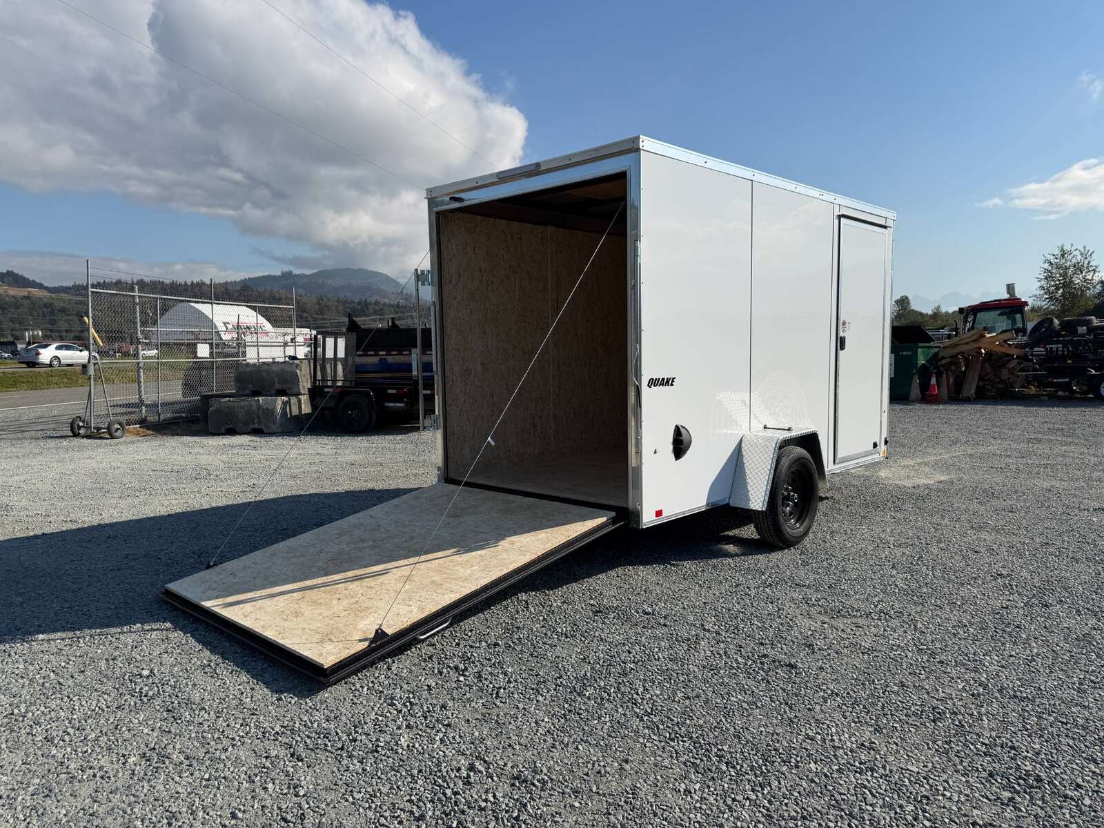 Photo of 2027 Impact Quake 6x12 V Nose Cargo / Enclosed Trailer / Polycor White Exterior / Ramp Door Extra Height 2990lb GVW