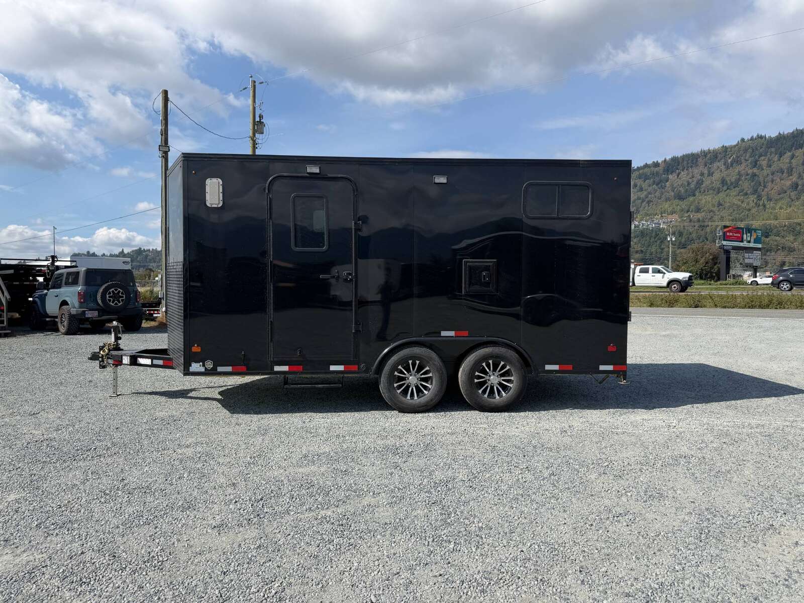 Photo of 2027 Royal 8.5x16 V Nose Cargo Enclosed Trailer Camping Package Black w/ Blackout Pkg, Insulated, Ramp Door, White Walls, 2x Windows, Polycor & More!